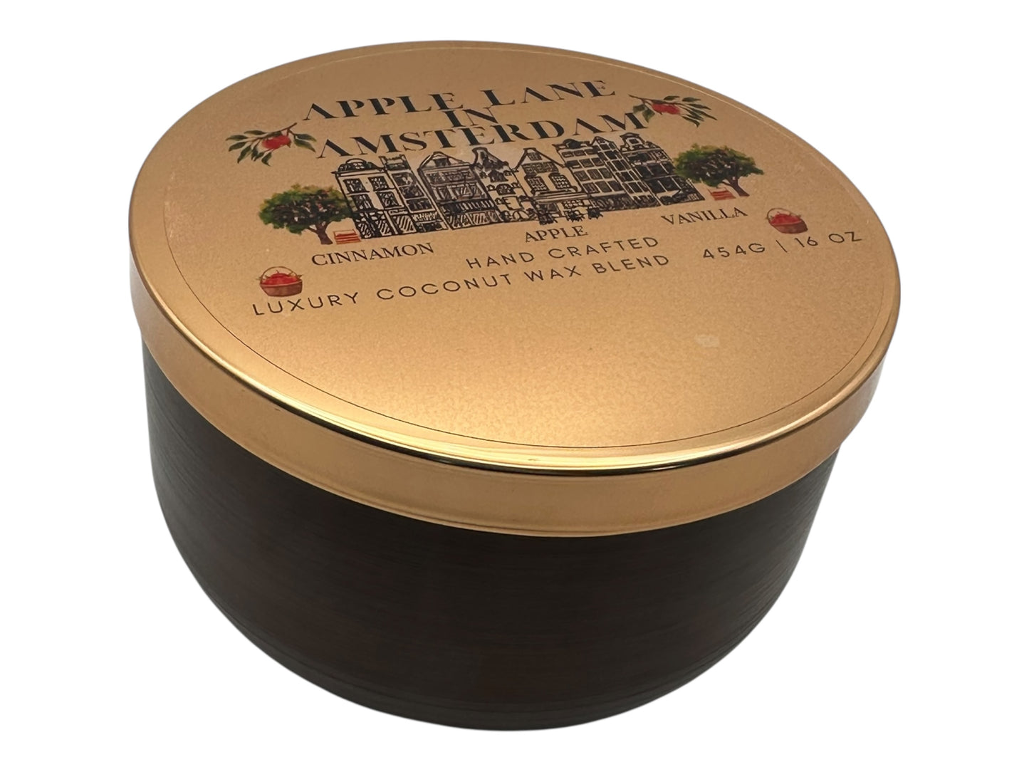 A bronze and gold candle tin labeled "Apple Lane in Amsterdam" with a decorative clear label on a white background.