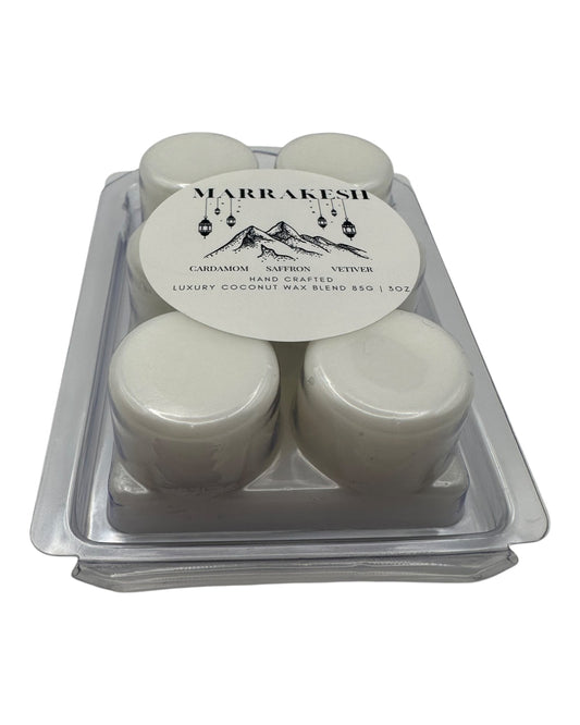 A plastic clamshell white wax melts labeled "Marrakesh" on a white background.