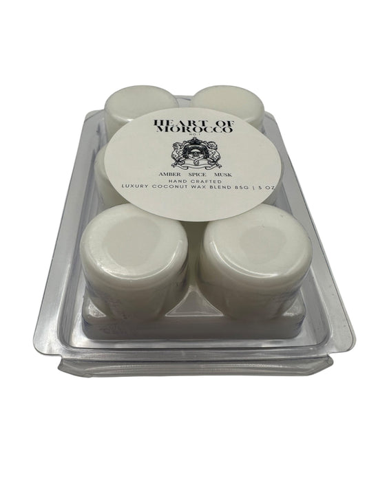 A plastic clamshell with white wax melts labeled "Heart of Morocco" on a white background.
