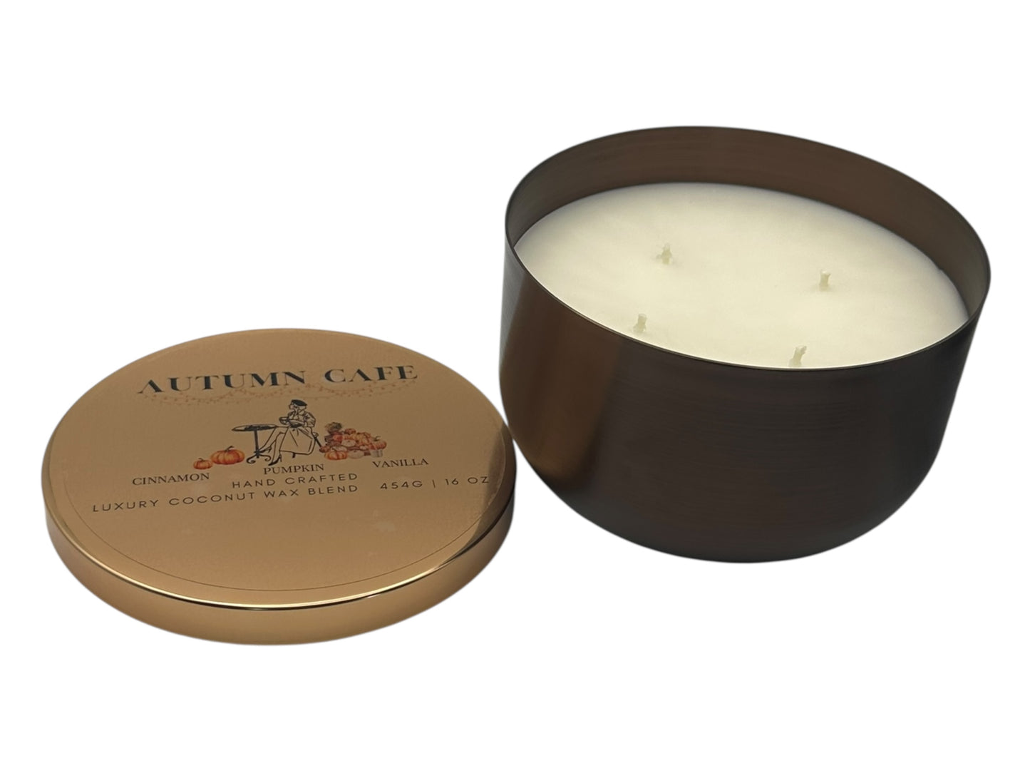 A bronze and gold candle tin with lid removed showing four candle wicks and a smooth white candle top on a white background.