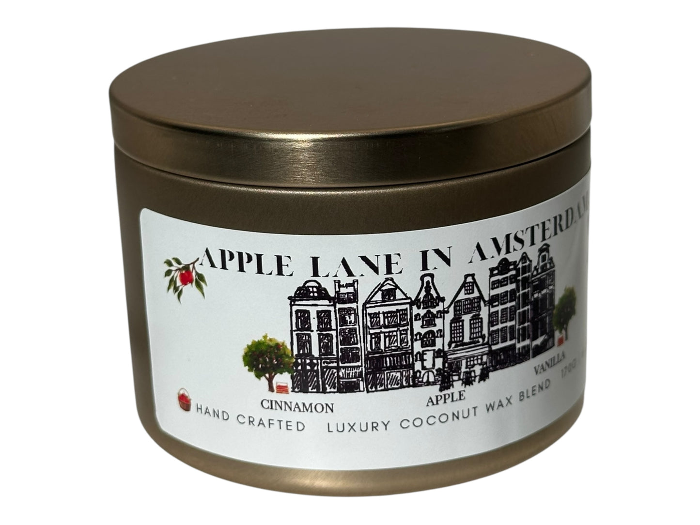 A gold candle tin with 'Apple Lane in Amsterdam' label side view on a white background.