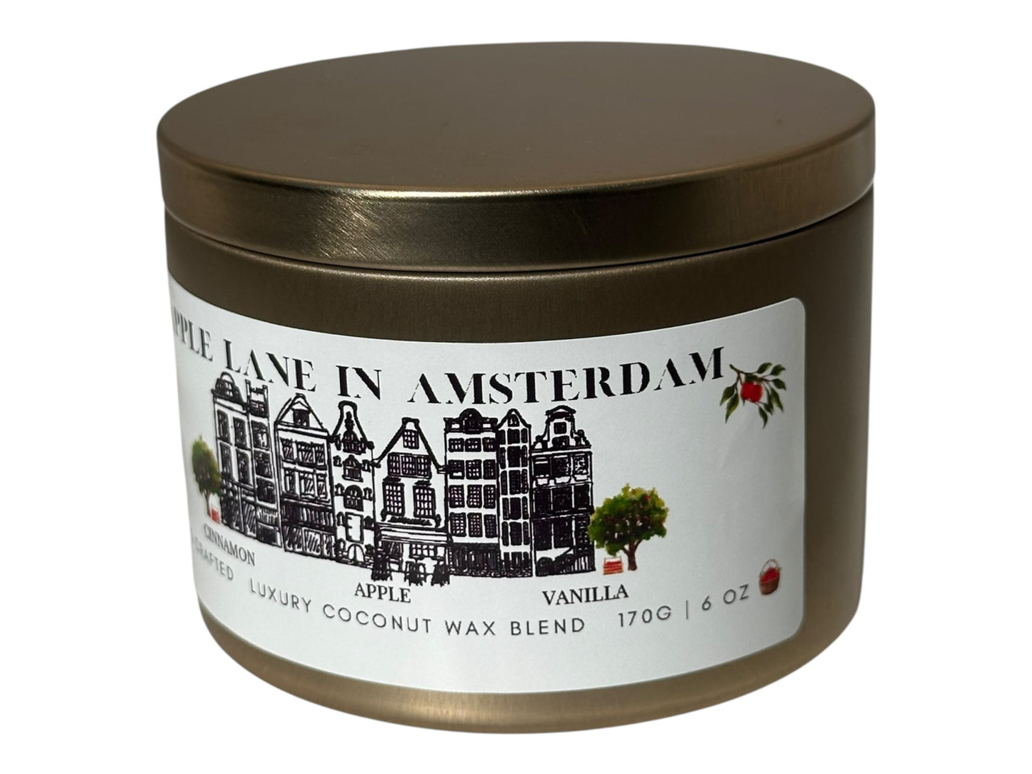 A gold candle tin with a label featuring a building illustration "Apple Lane in Amsterdam" on a white background.