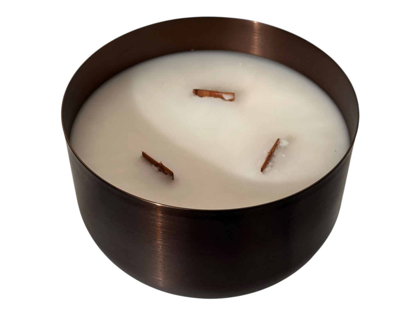 A bronze candle tin with three wood wicks and a white smooth candle top on a white background.