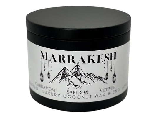 A black candle tin labeled "Marrakesh" on a white background.