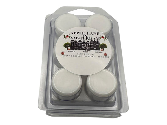Pack of "Apple Lane Amsterdam" wax melts in clear packaging on a white background.