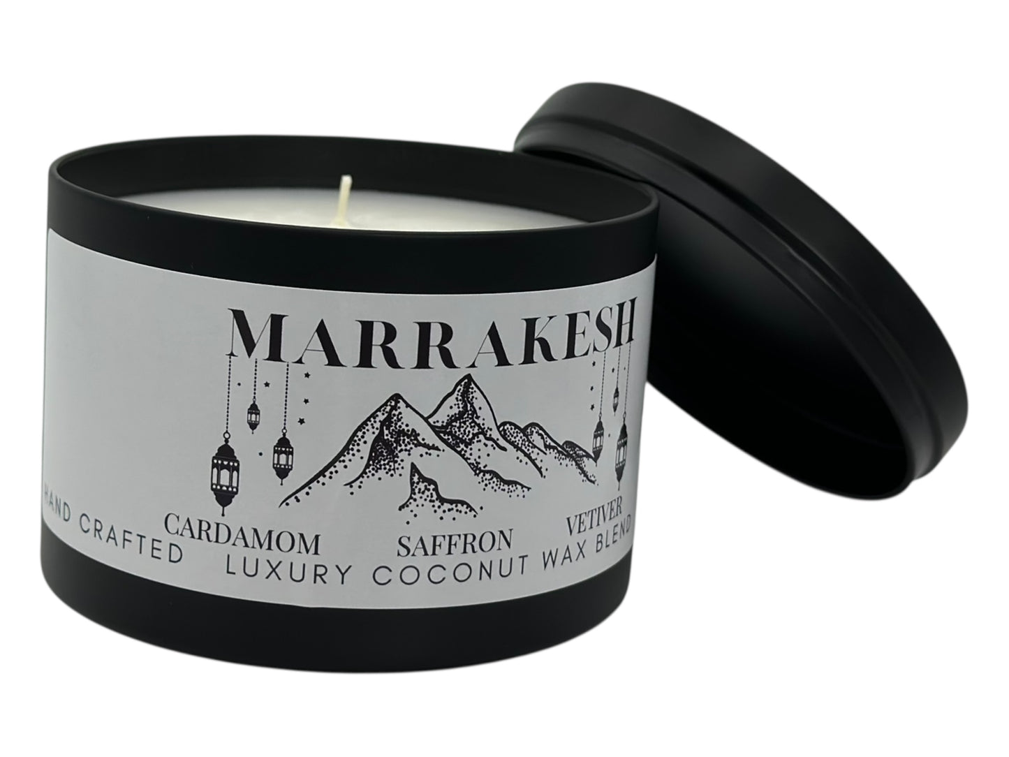 A black candle tin labeled "Marrakesh" with lid removed on a white background.