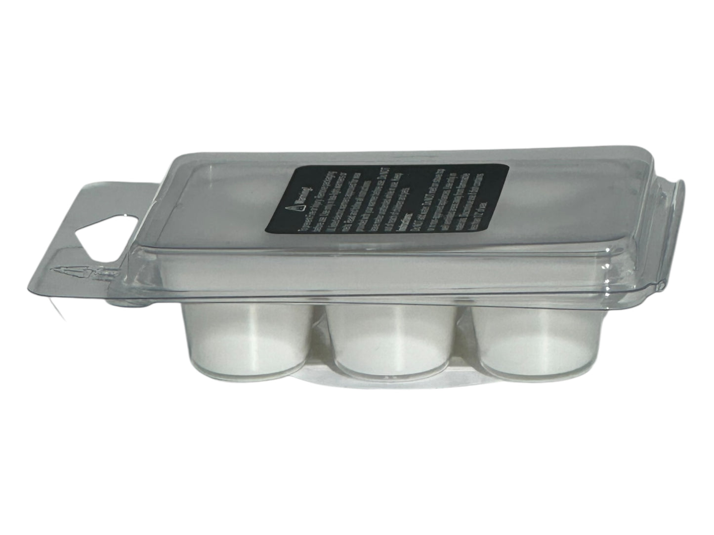 A winter wax melt labeled with safety information in a clear clamshell with a matte printed label on a white background.