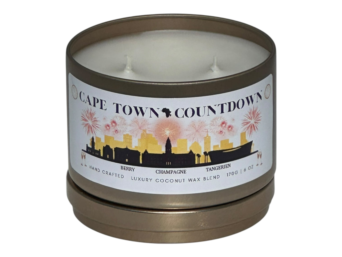A new year's gold candle tin called, "Cape Town Countdown" on a white background with lid removed.