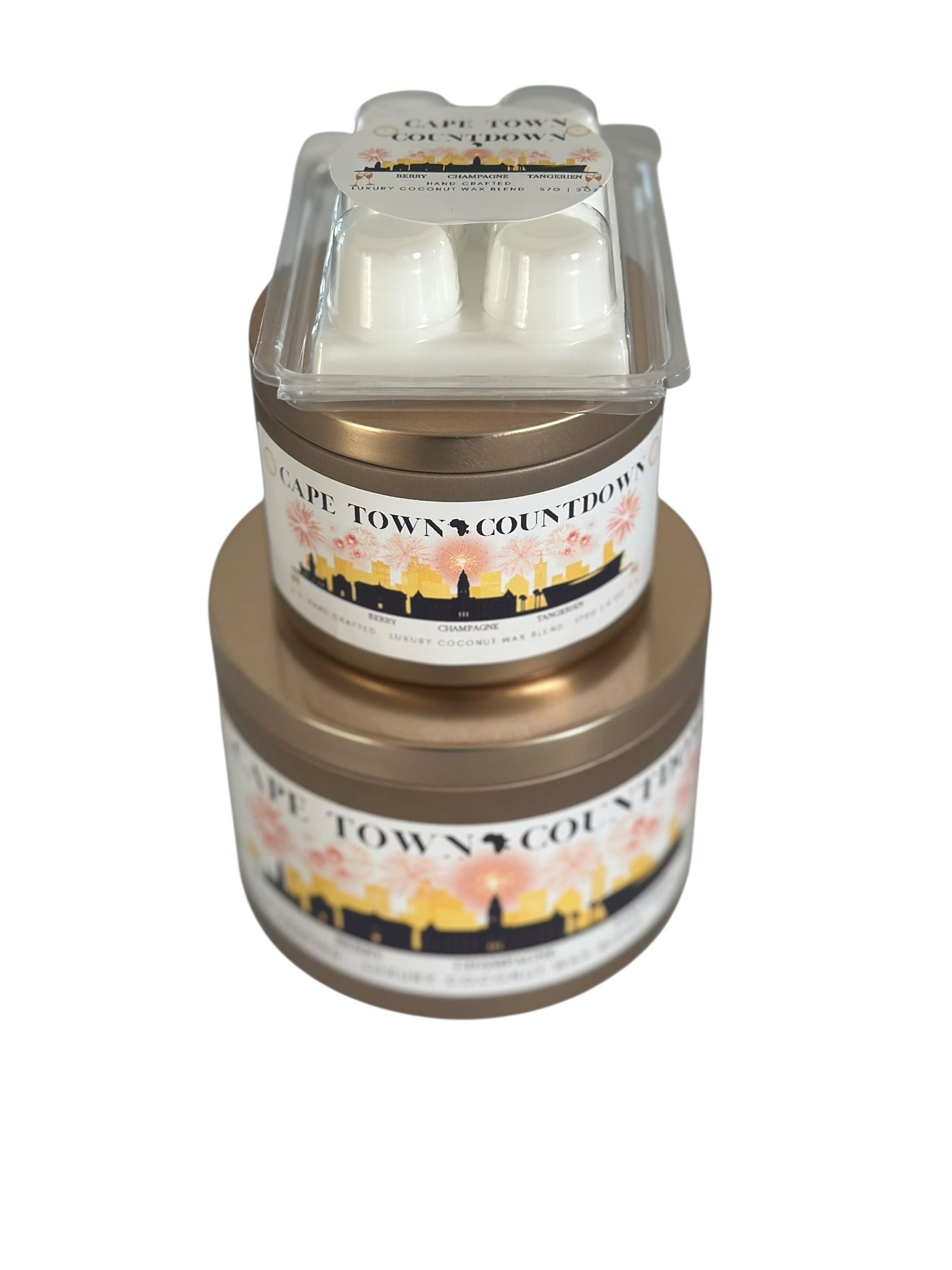 A holiday collection of gold candle tins and white wax melt labeled "Cape Town Countdown" on a white background