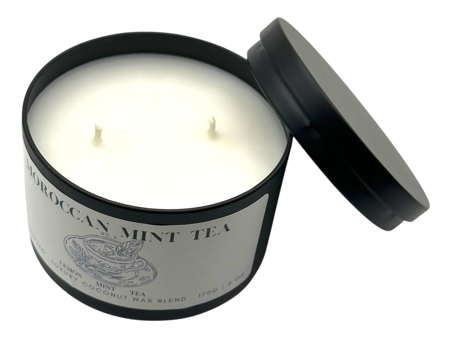 Candle in a Moroccan Mint Tea container with a black lid on a white background