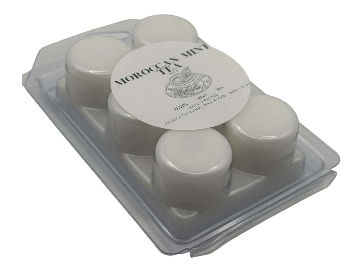 A white wax melt labeled Moroccan Mint Tea side view on a white background.
