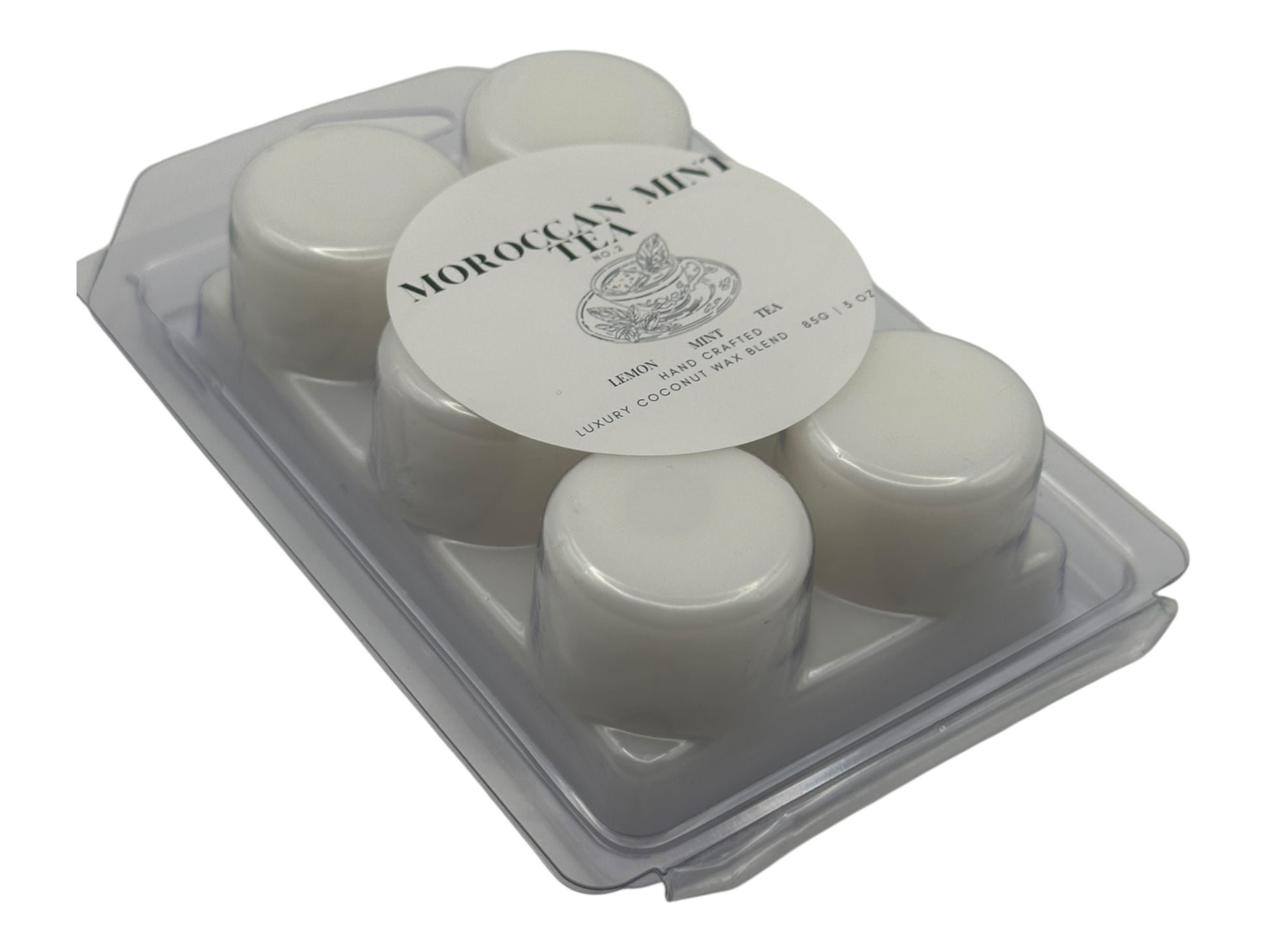A white wax melt labeled Moroccan Mint Tea side view on a white background.