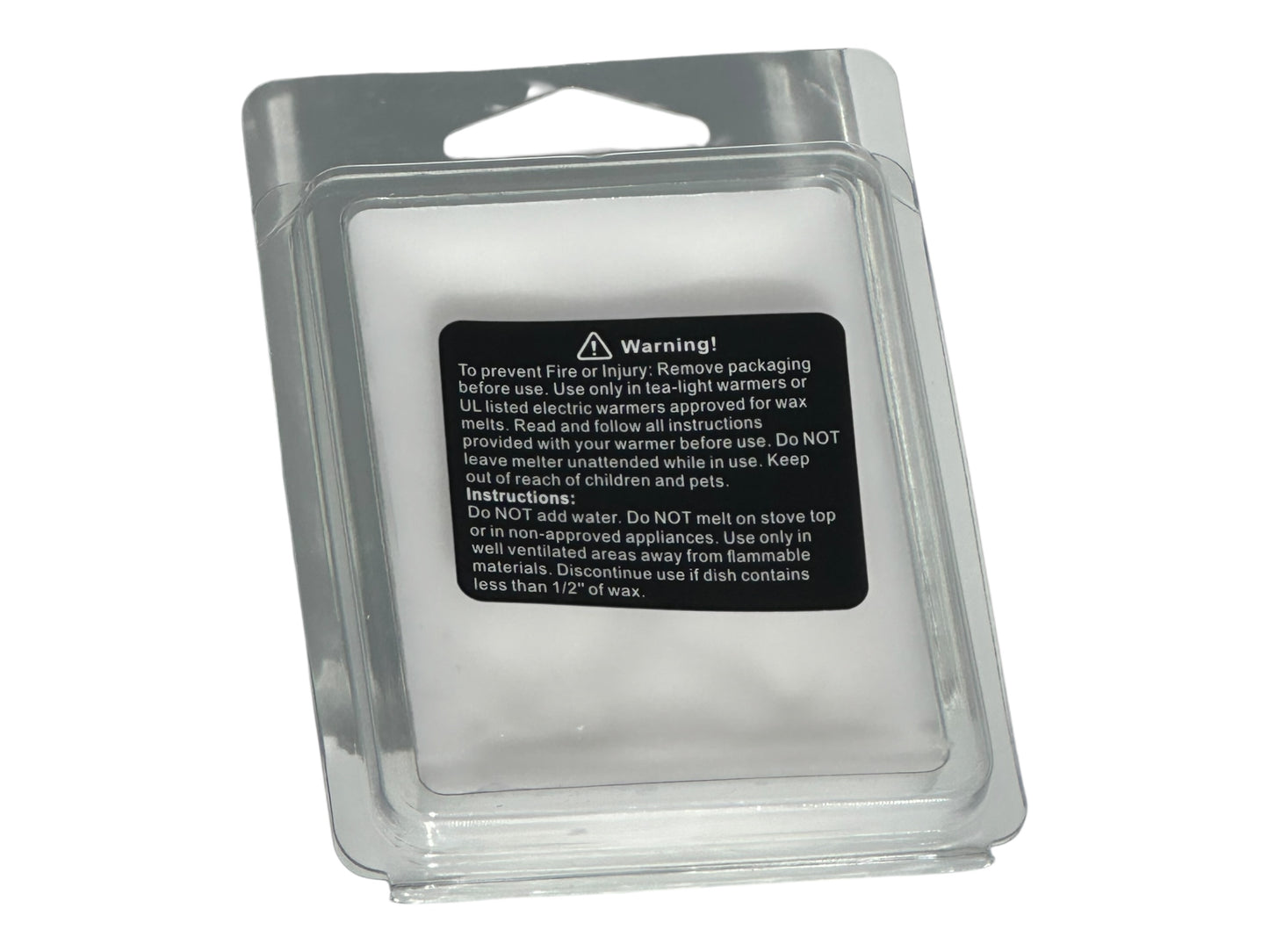 A winter wax melt labeled with safety information in a clear clamshell with a matte printed label on a white background.
