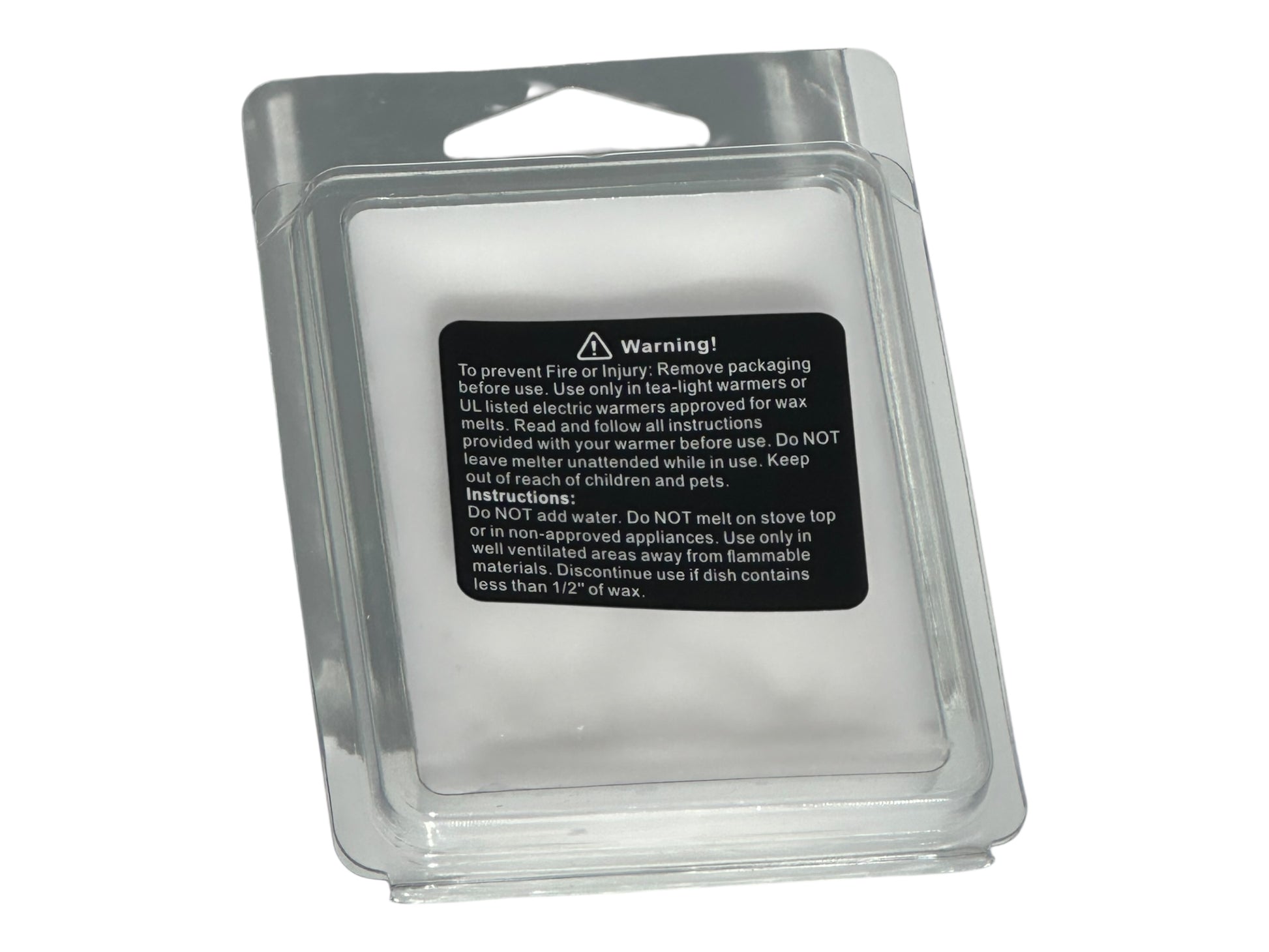 A winter wax melt labeled with safety information in a clear clamshell with a matte printed label on a white background.