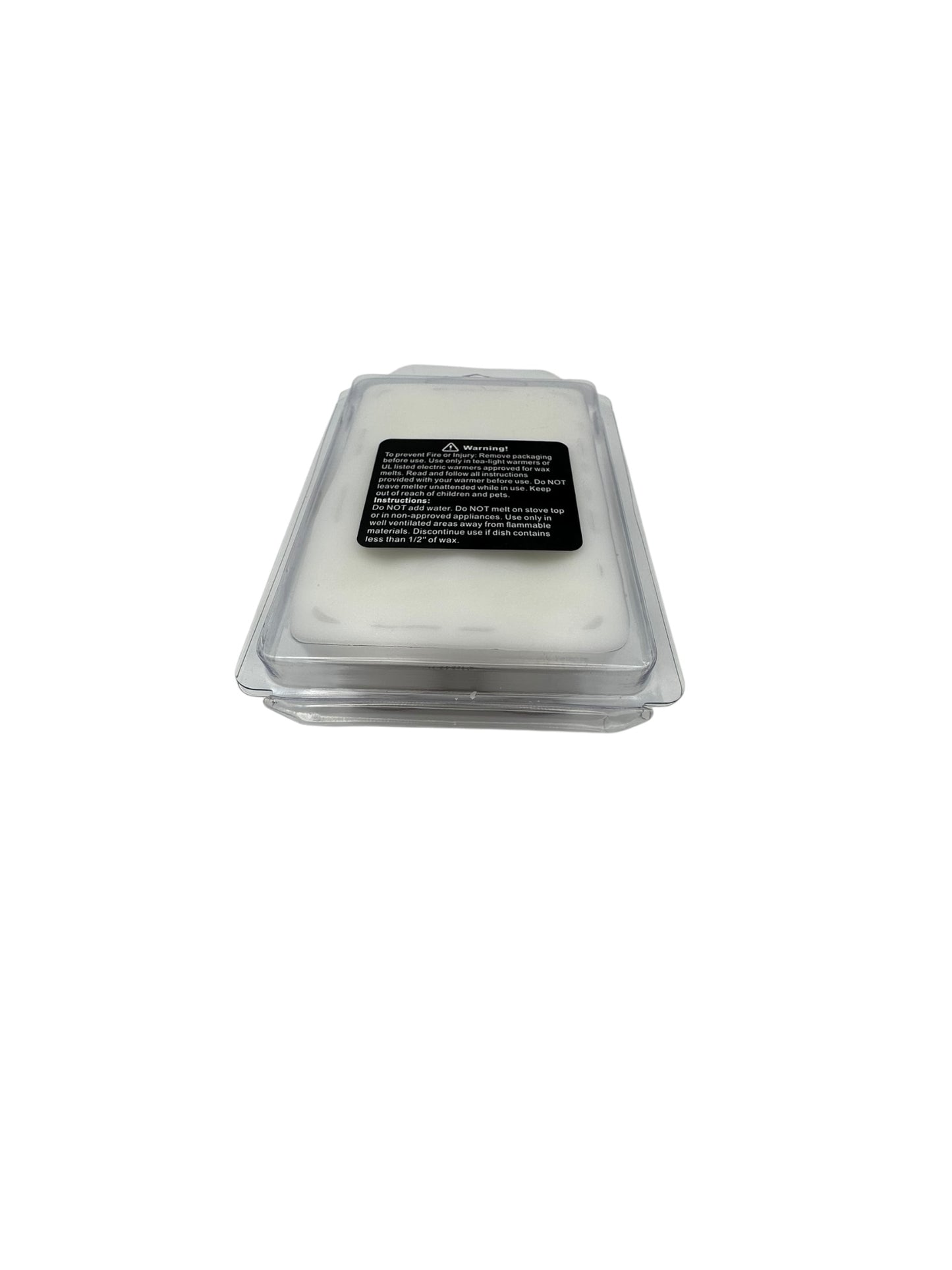 A plastic clamshell with white wax melts and a safety warning label on the package on a white background. 