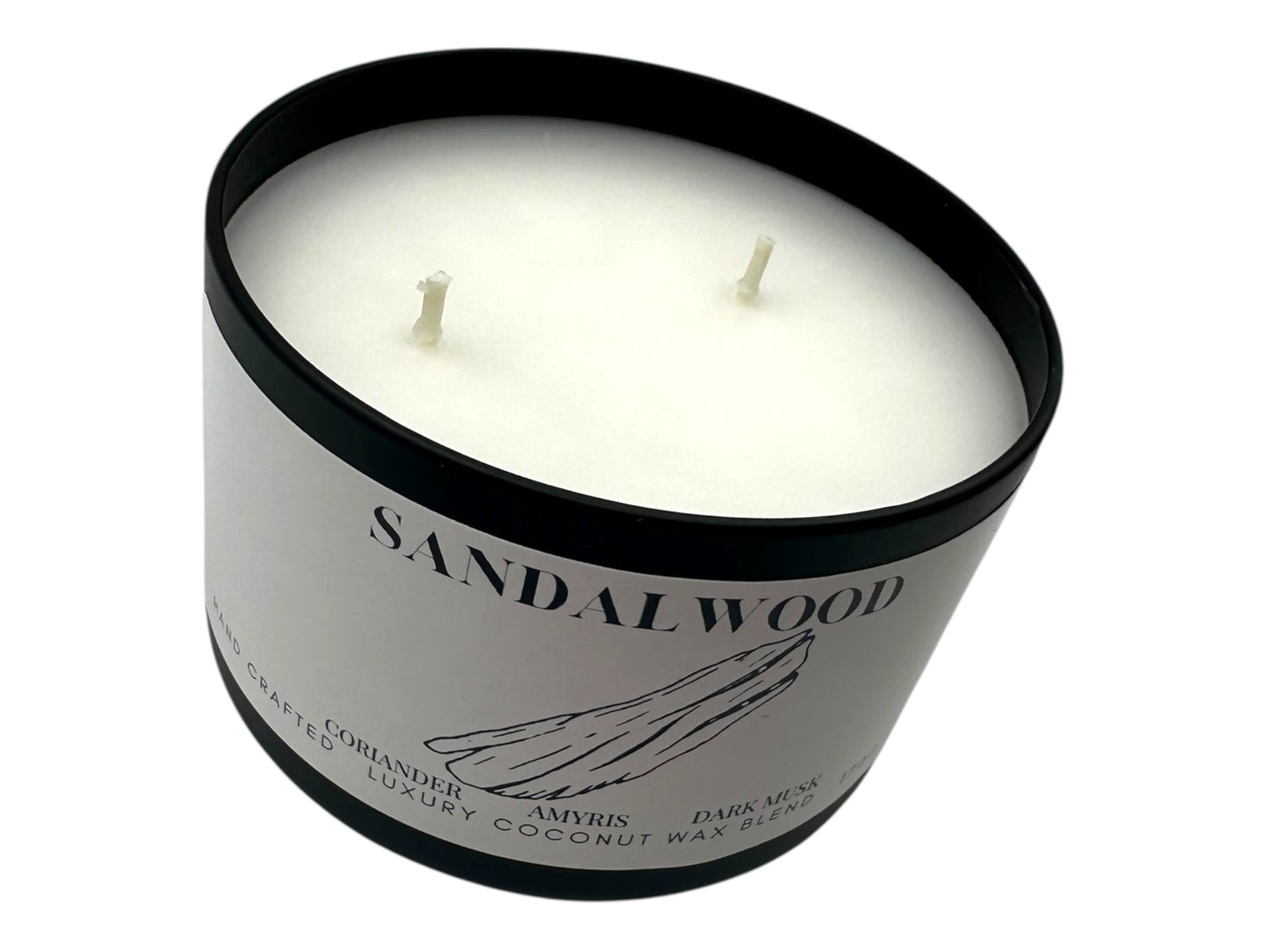 A black candle tin labeled "Sandalwood" no lid with two wicks and a smooth white candle top on a white background.