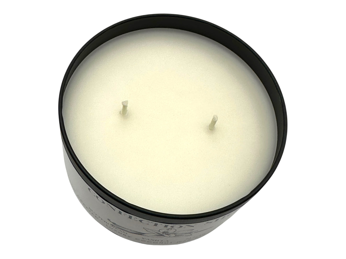 A black candle tin labeled "Confection Shop" two wicks and smooth white candle top on a white background. 