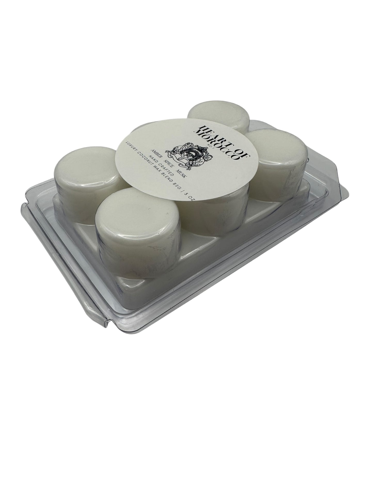 A plastic clamshell with white wax melts labeled "Heart of Morocco" on a white background.