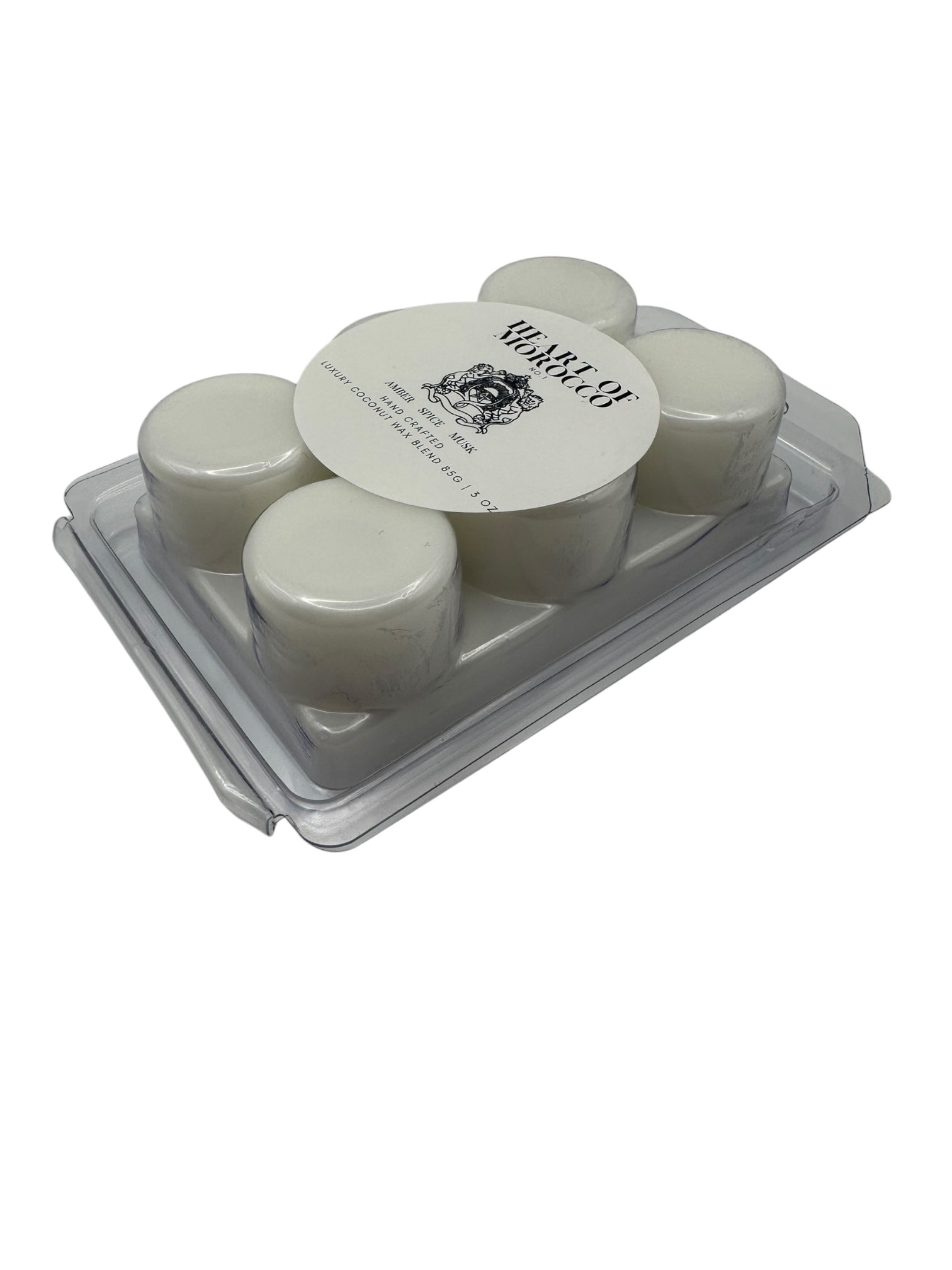 A plastic clamshell with white wax melts labeled "Heart of Morocco" on a white background.