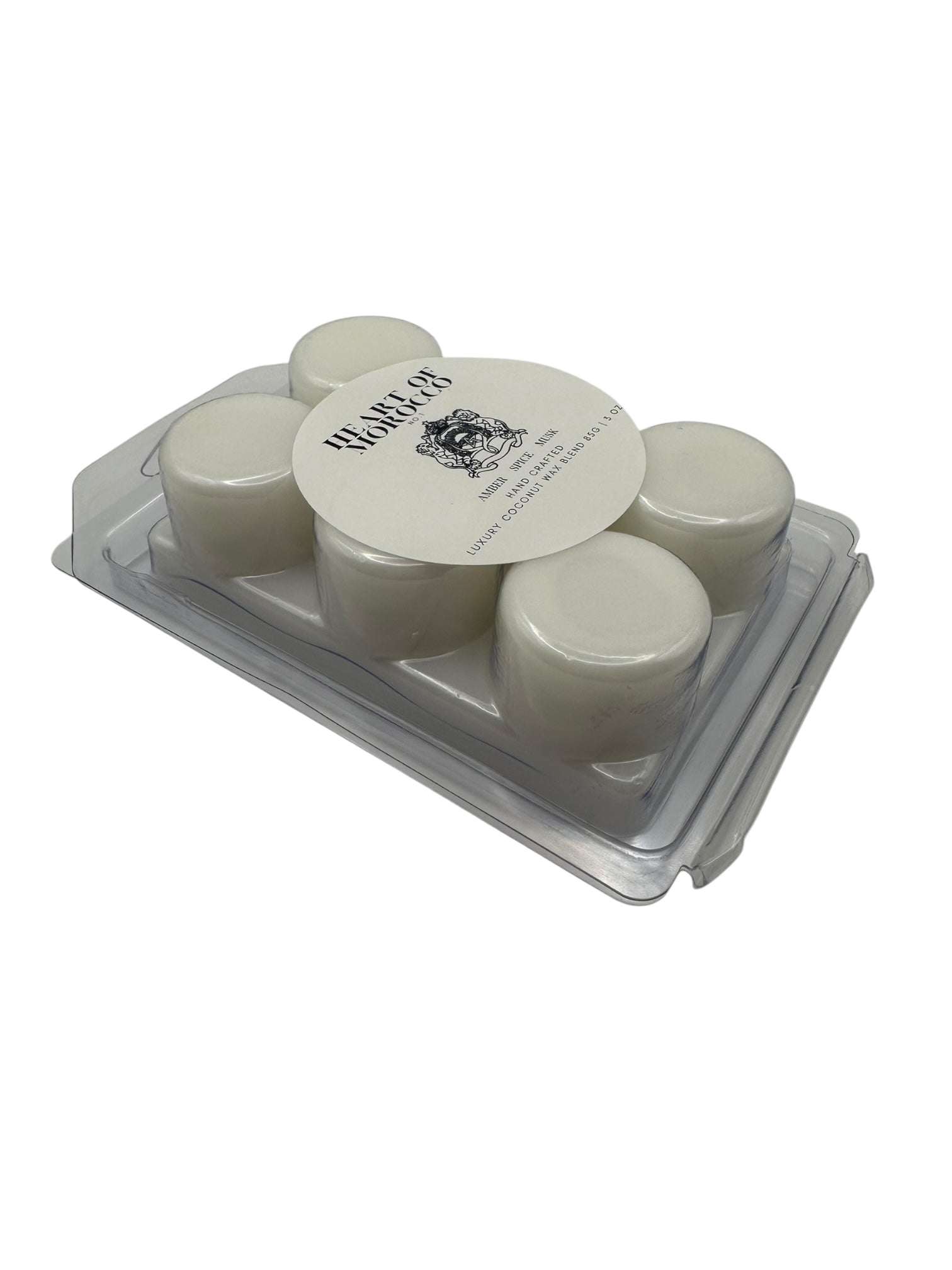A plastic clamshell with white wax melts labeled "Heart of Morocco" on a white background.