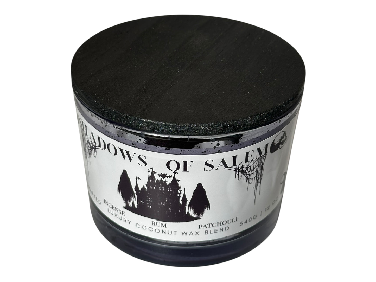 A purple candle jar with pearl black wooden lid  labeled 'Shadows of Salem' on a white background.