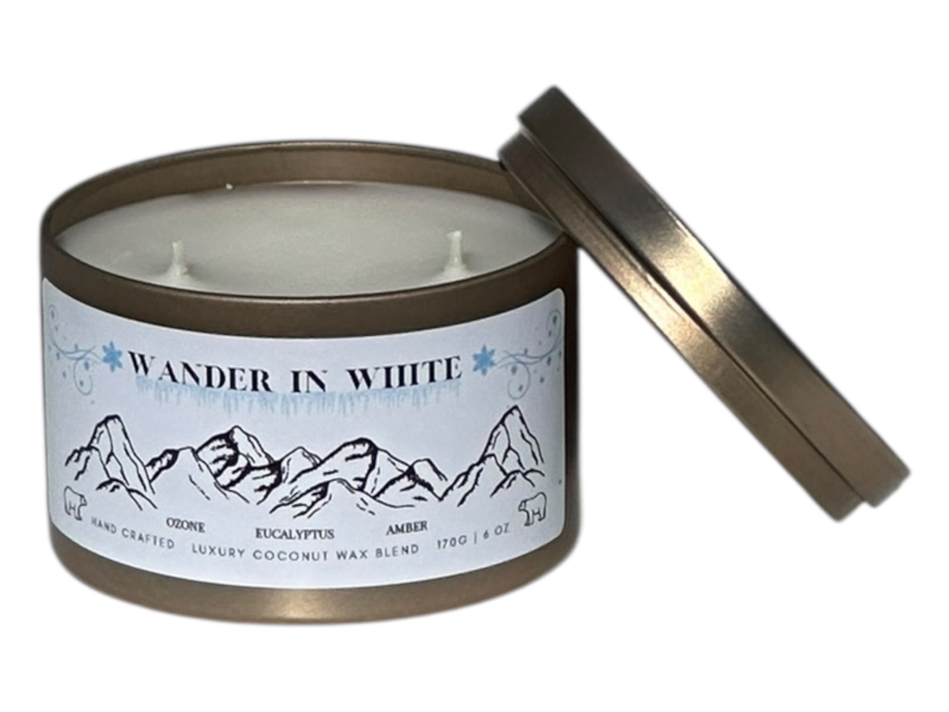 gold candle tin with 'Wander in White' label on a white background with lid removed showing two candle wicks on the top.