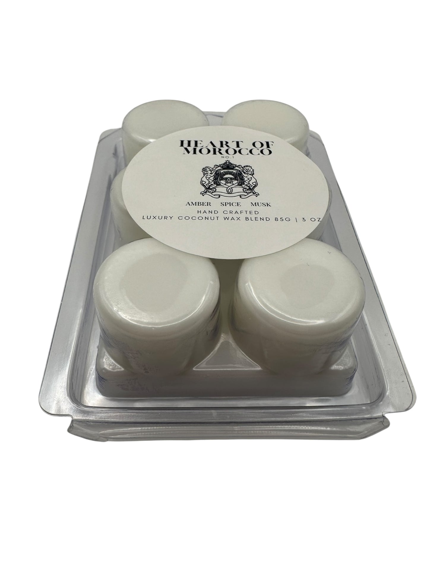 A plastic clamshell with white wax melts labeled "Heart of Morocco" on a white background.