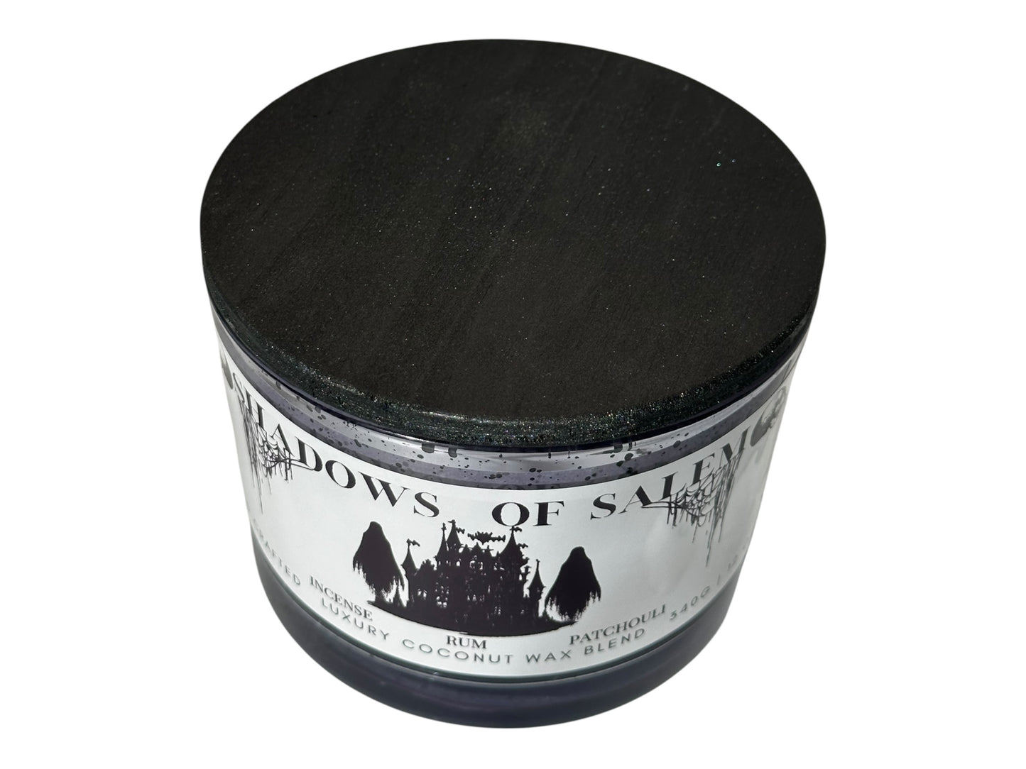 A purple candle jar labeled 'Shadows of Salem' on a white background.