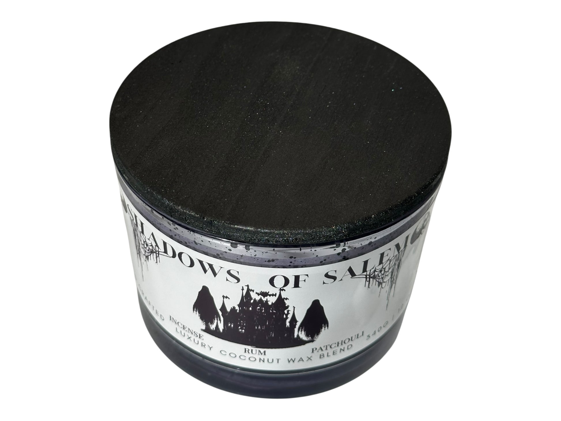 A purple candle jar labeled 'Shadows of Salem' on a white background.