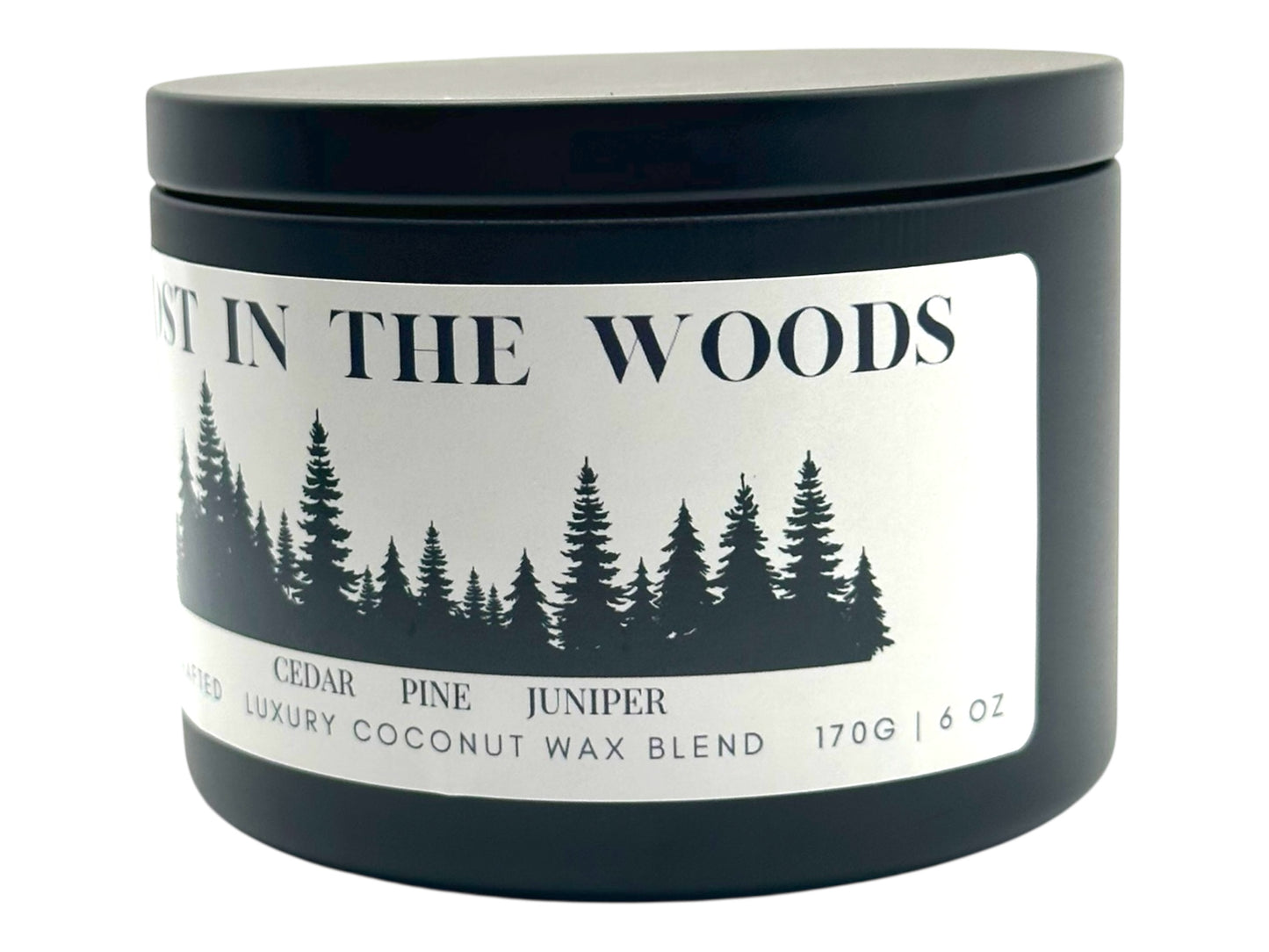 A black candle tin labeled "Lost in the Woods" on a white background. 
