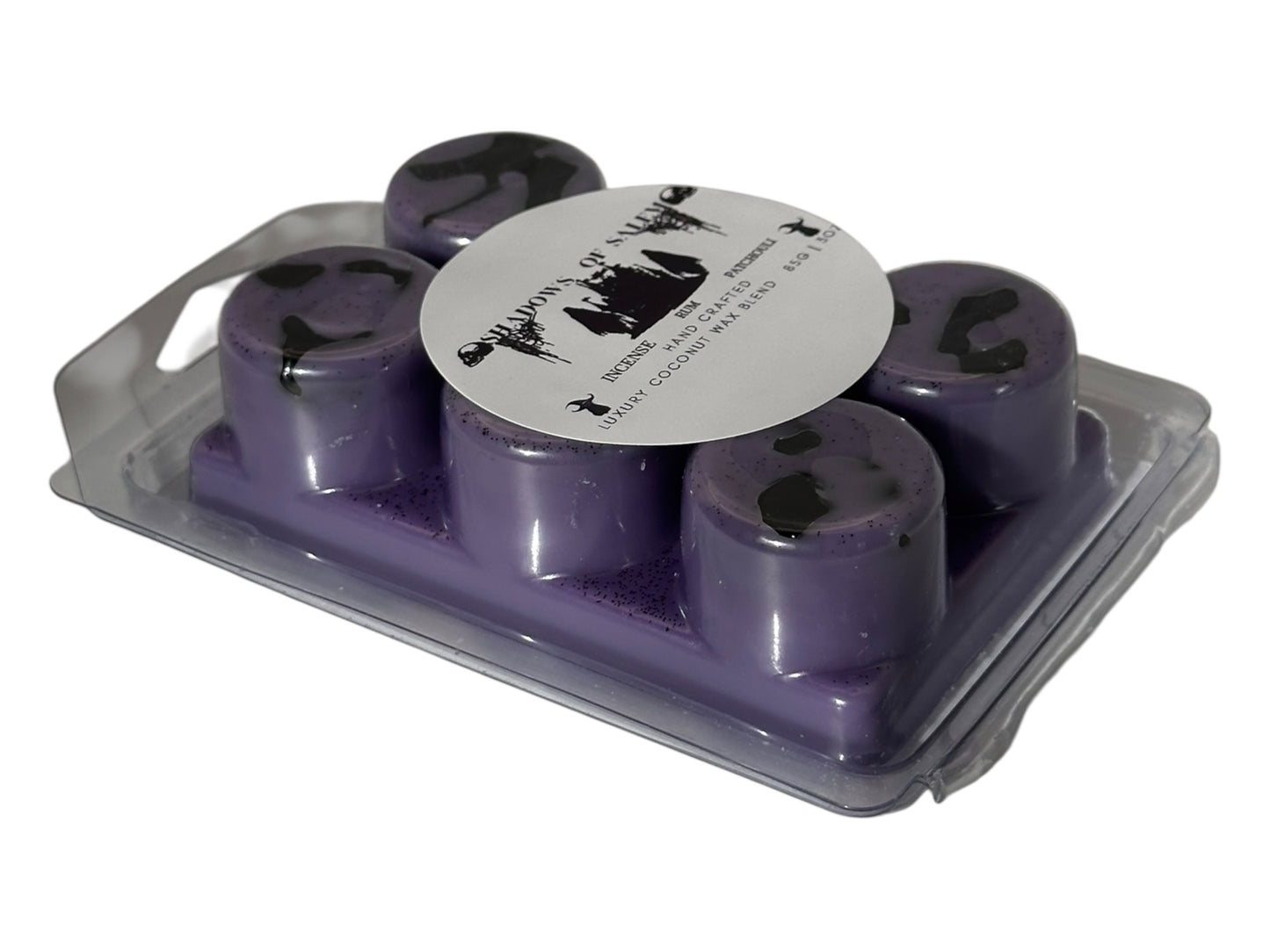 A side view of purple wax melts labeled 'Shadows of Salem" on a white background.