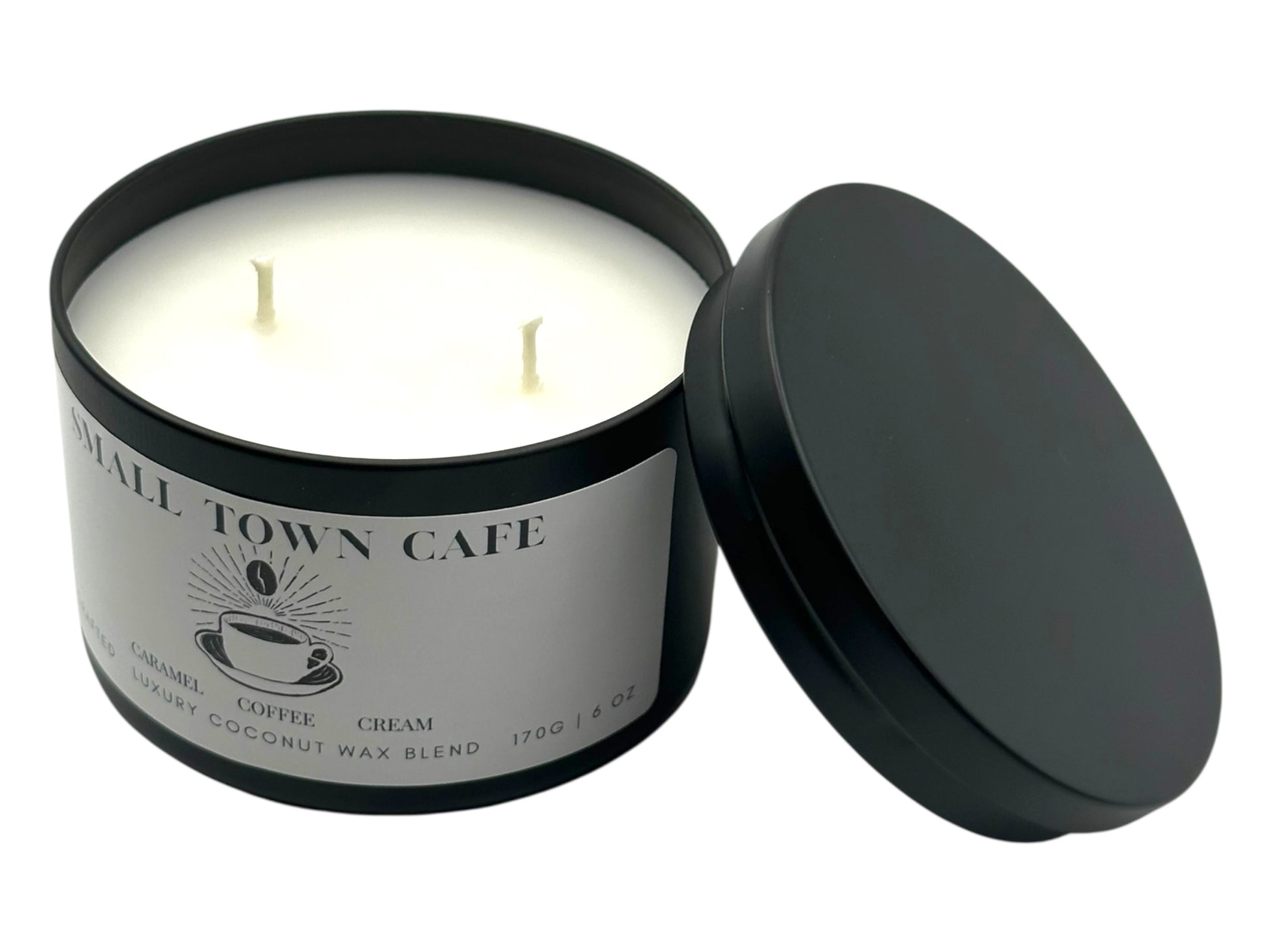 A black candle tin labeled "Small Town Cafe" with the lid removed on a white background.
