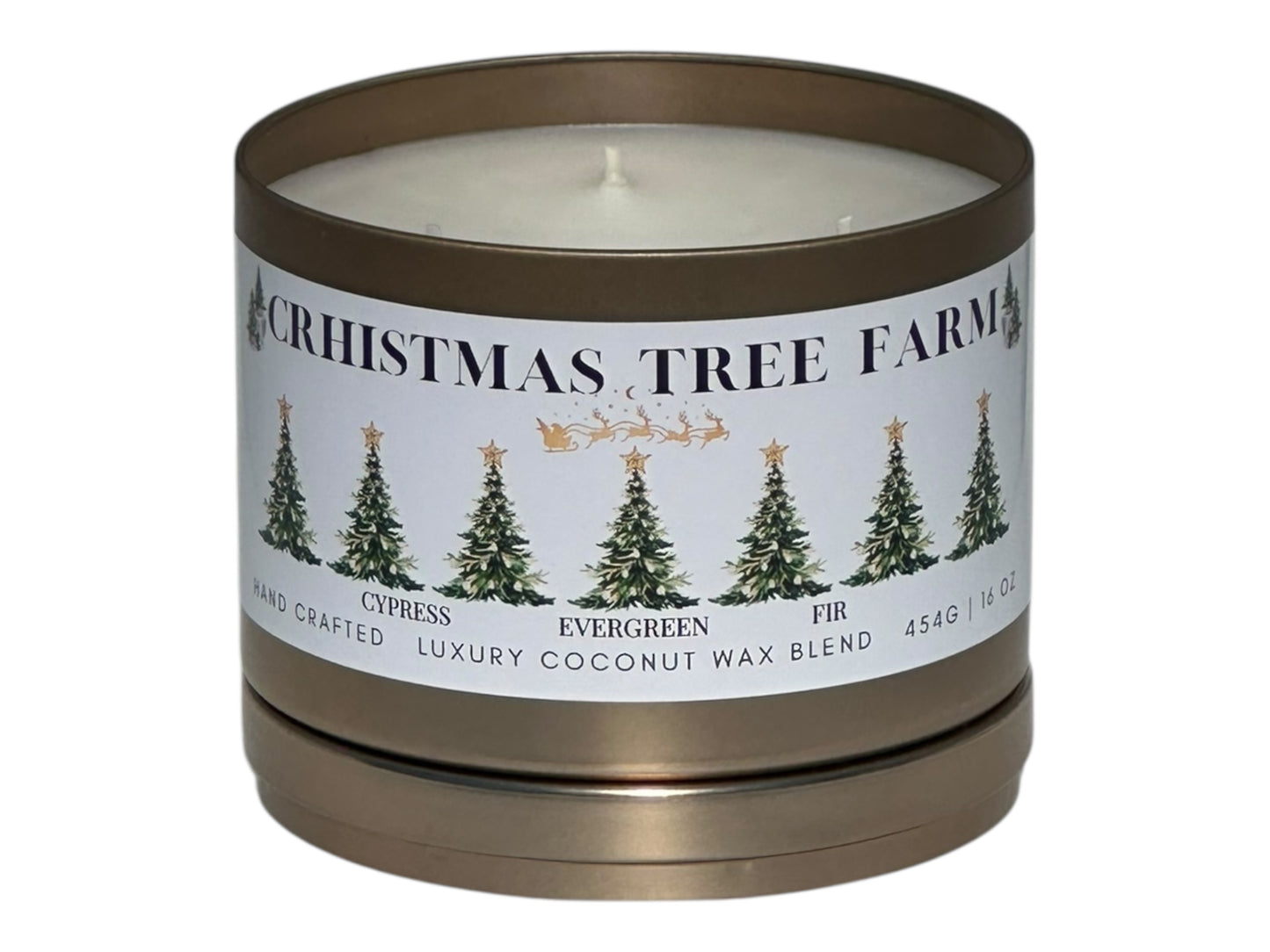 A gold candle tin labeled "Christmas  Tree Farm" on a white background front view with lid removed.
