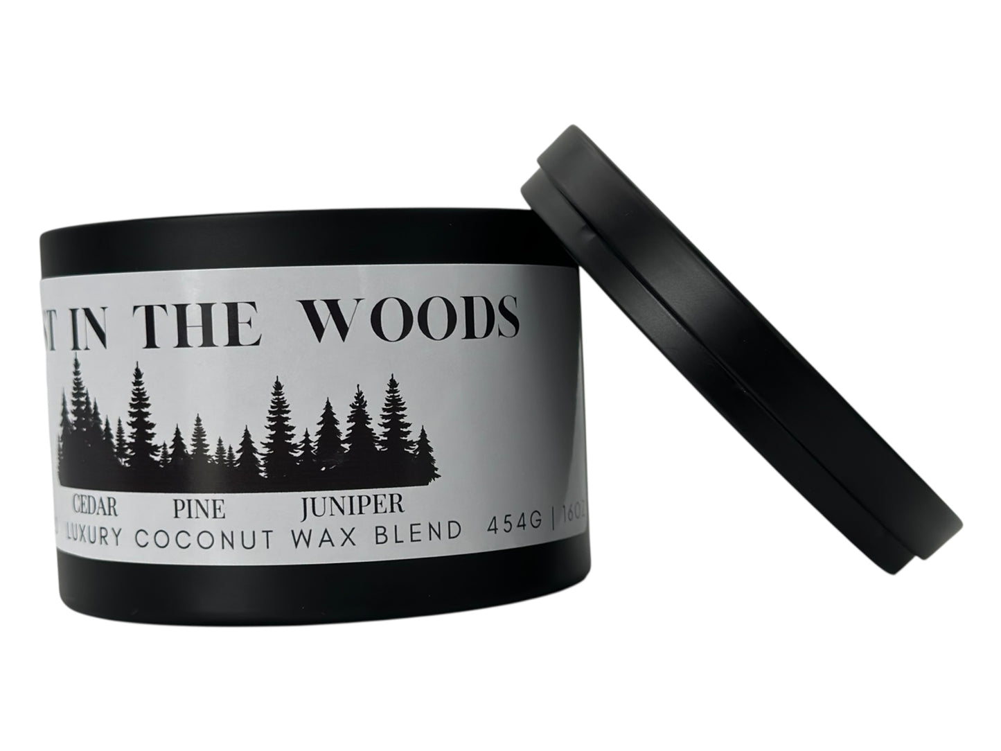 A black candle tin labeled "Lost in the Woods" on a white background.