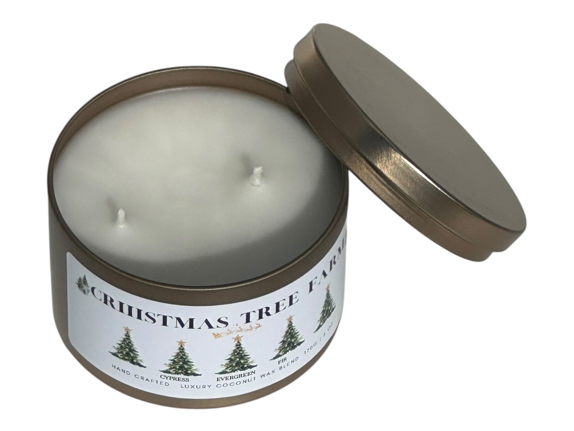 a gold candle tin labeled "Christmas Tree Farm" with lid removed on a white background. Top view.
