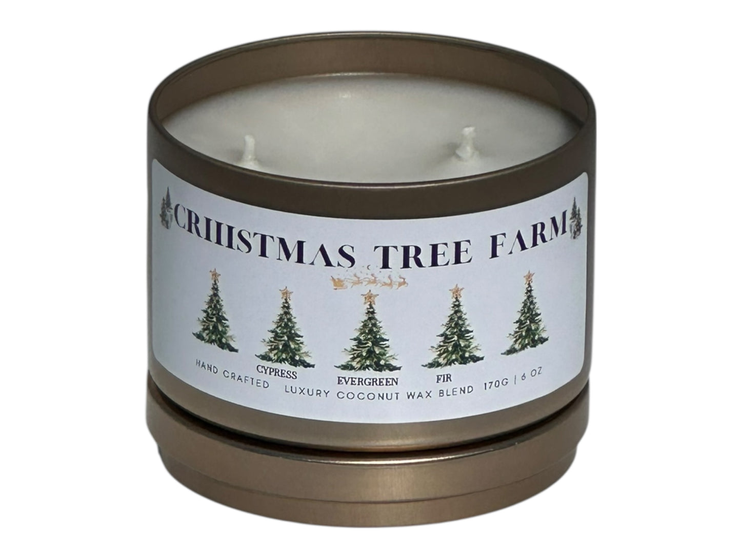 a gold candle tin labeled "Christmas Tree Farm" with lid removed on a white background front view with lid under candle.