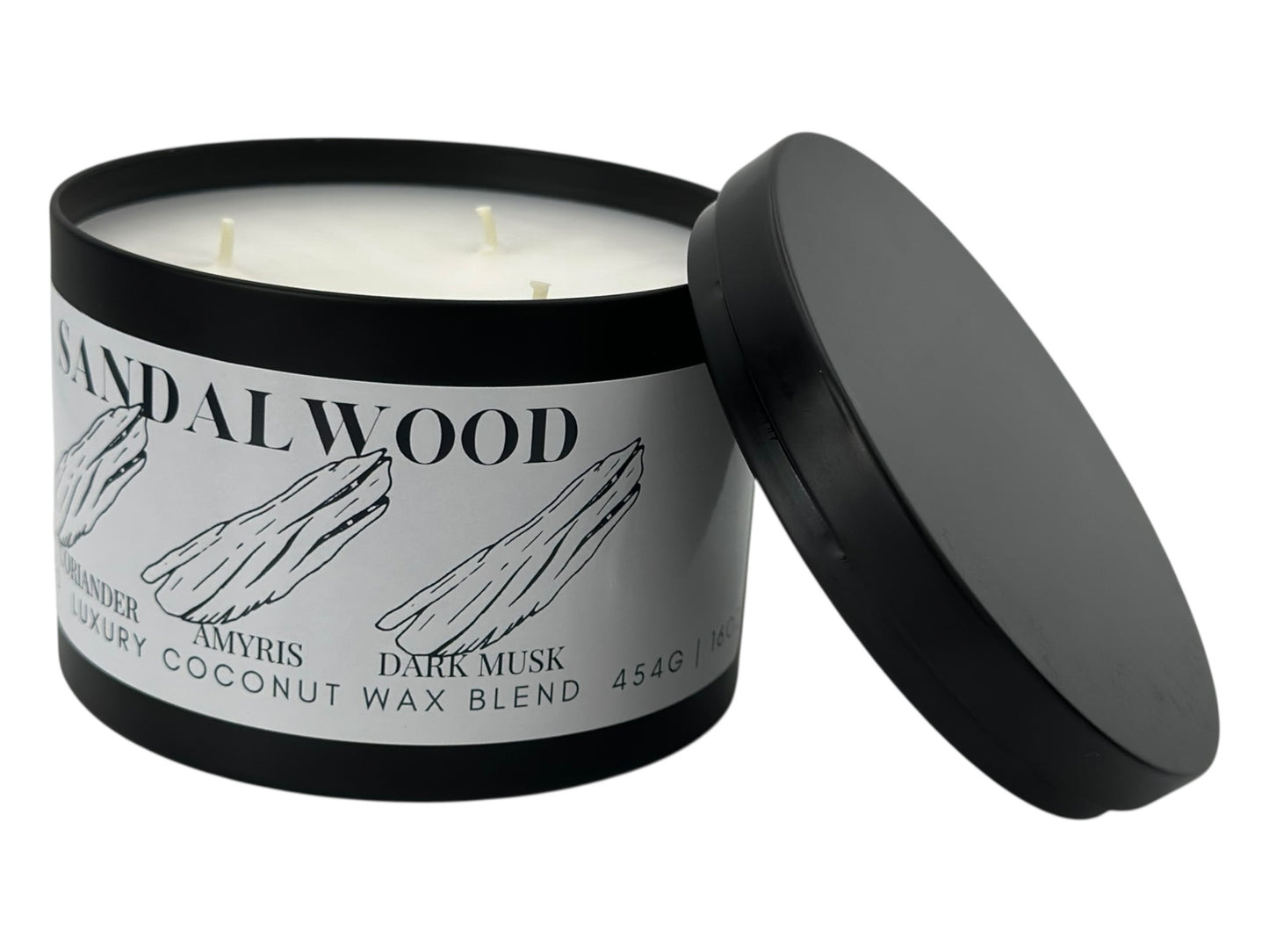 A black candle tin labeled "Sandalwood" with lid removed on a white background.