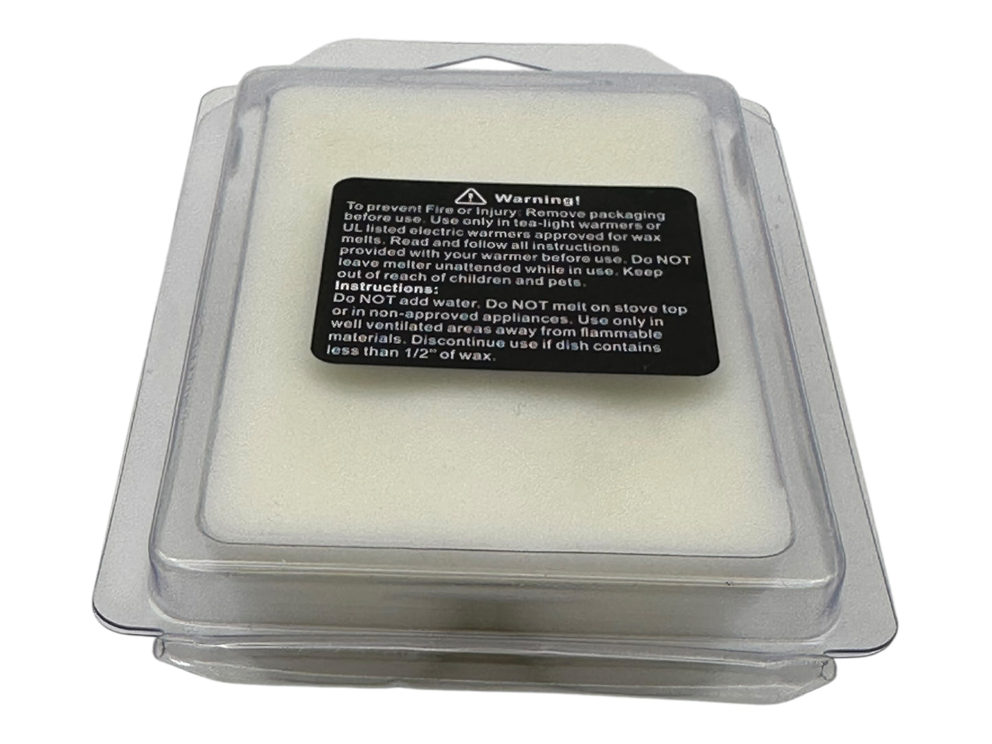 Packaged wax melt with warning label on a white background.