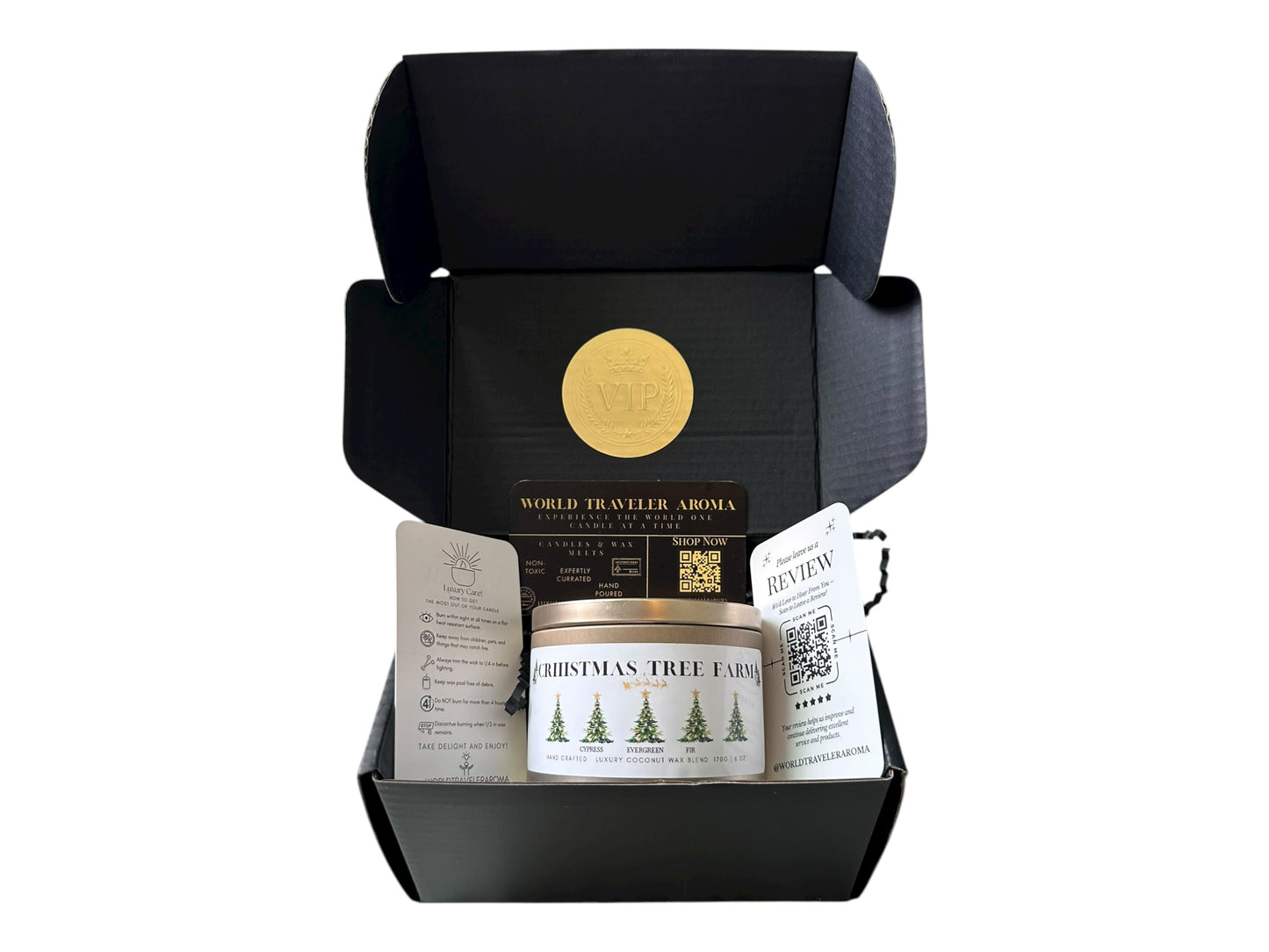 A black gift box with a gold VIP sticker on the lid inside the box a gold candle tin labeled "Christmas Tree Farm" a candle care care instructions, a please review us card, and a World Traveler Aroma business card on a white background.