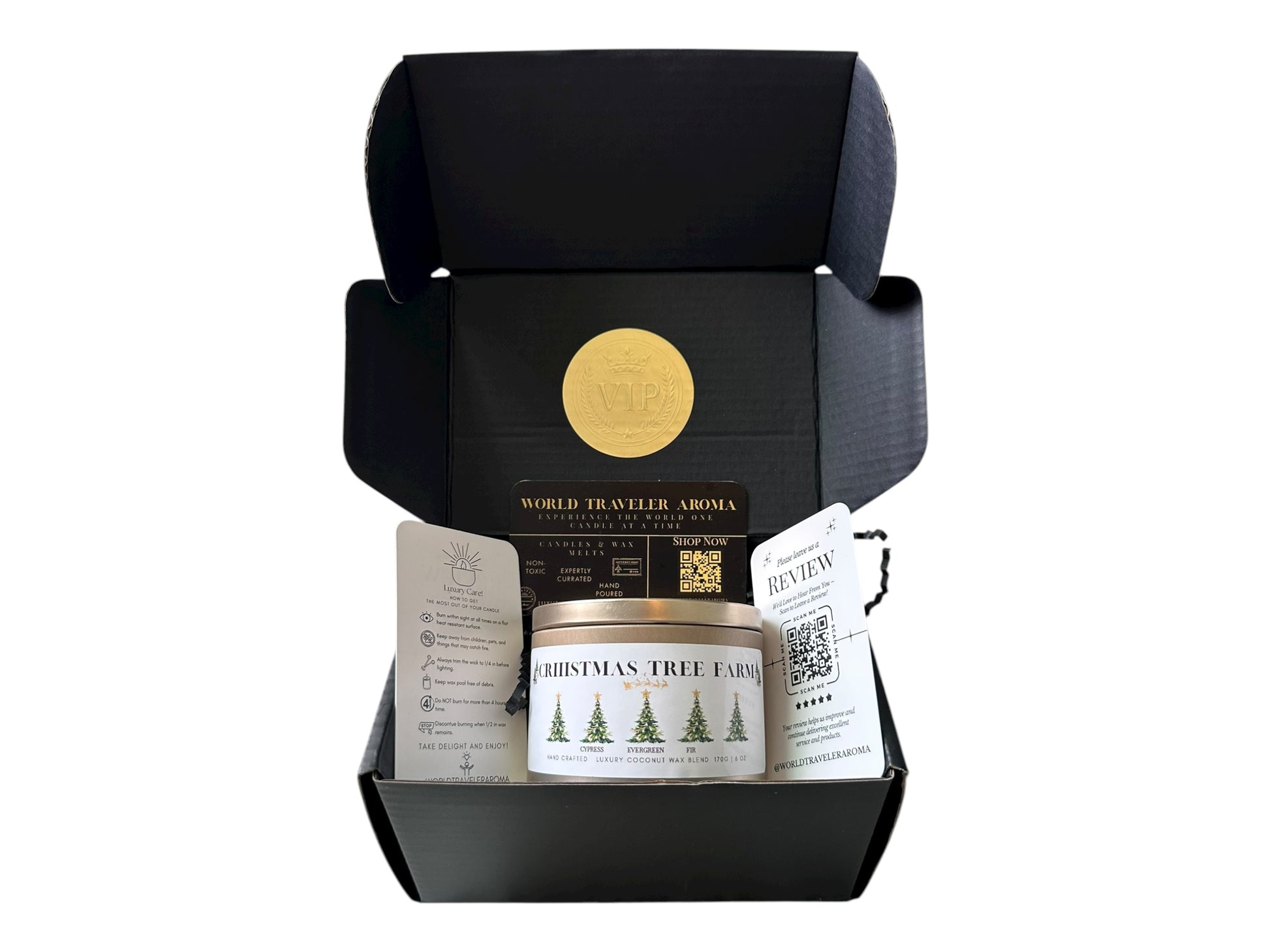 A black gift box with a gold VIP sticker on the lid inside the box a gold candle tin labeled "Christmas Tree Farm" a candle care care instructions, a please review us card, and a World Traveler Aroma business card on a white background.
