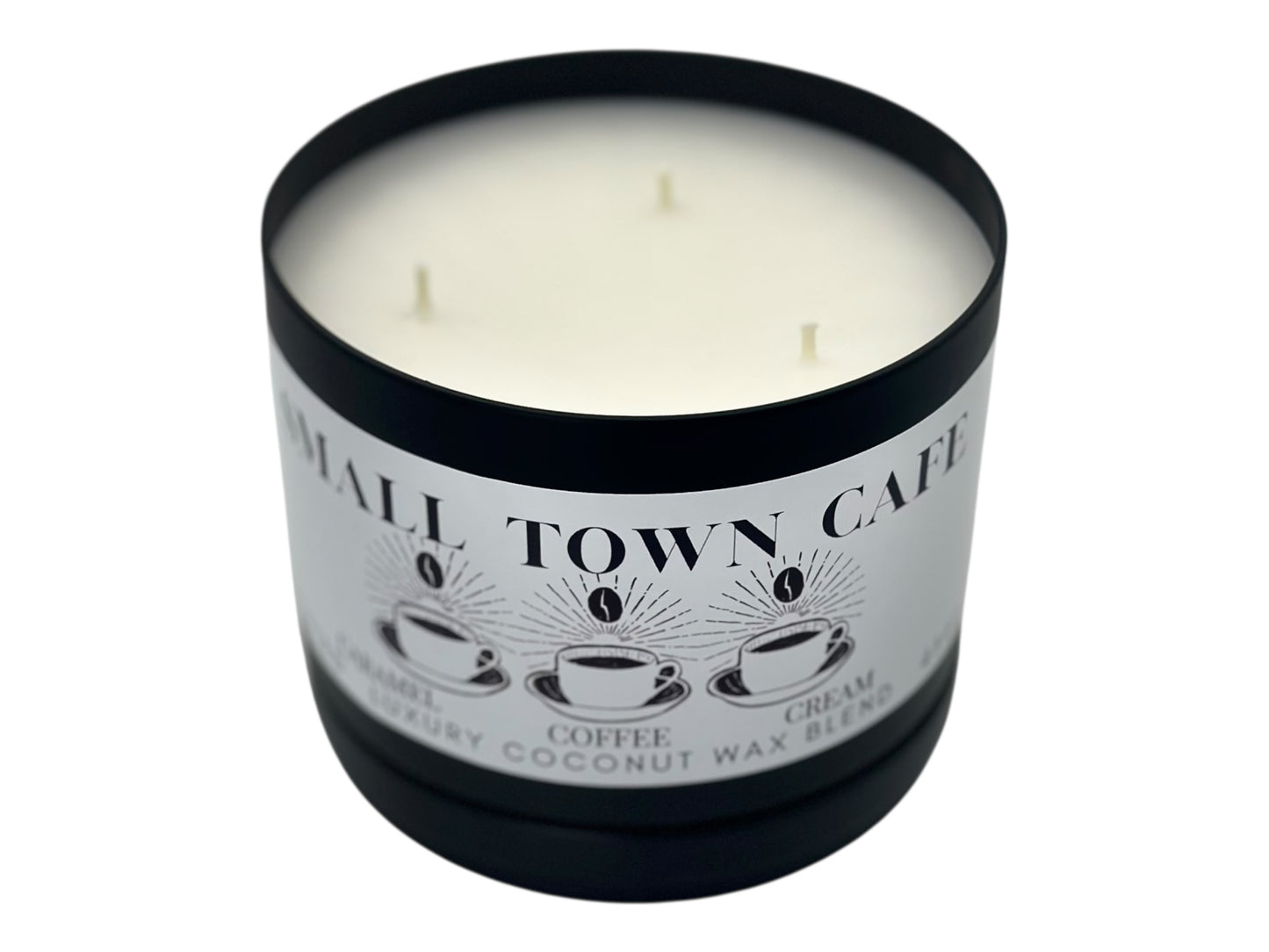 A black candle tin labeled "Small Town Cafe" with lid removed on a white background.