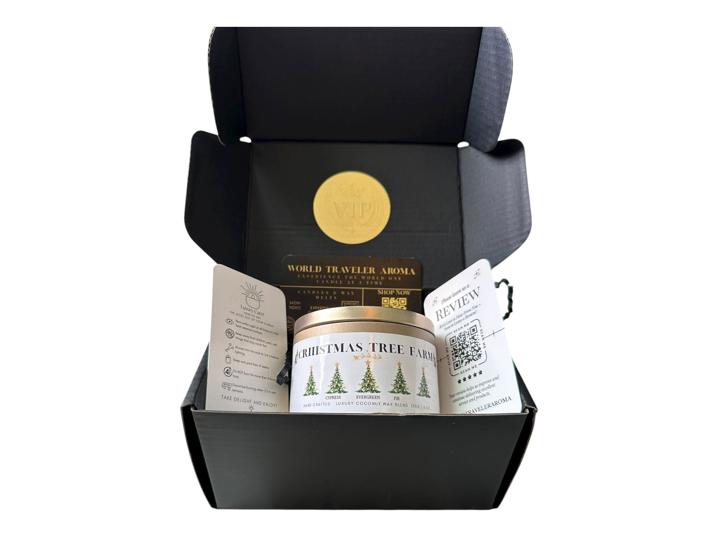 A black gift box with a gold VIP sticker on the lid inside the box a gold candle tin labeled "Christmas Tree Farm" a candle care care instructions, a please review us card, and a World Traveler Aroma business card on a white background.