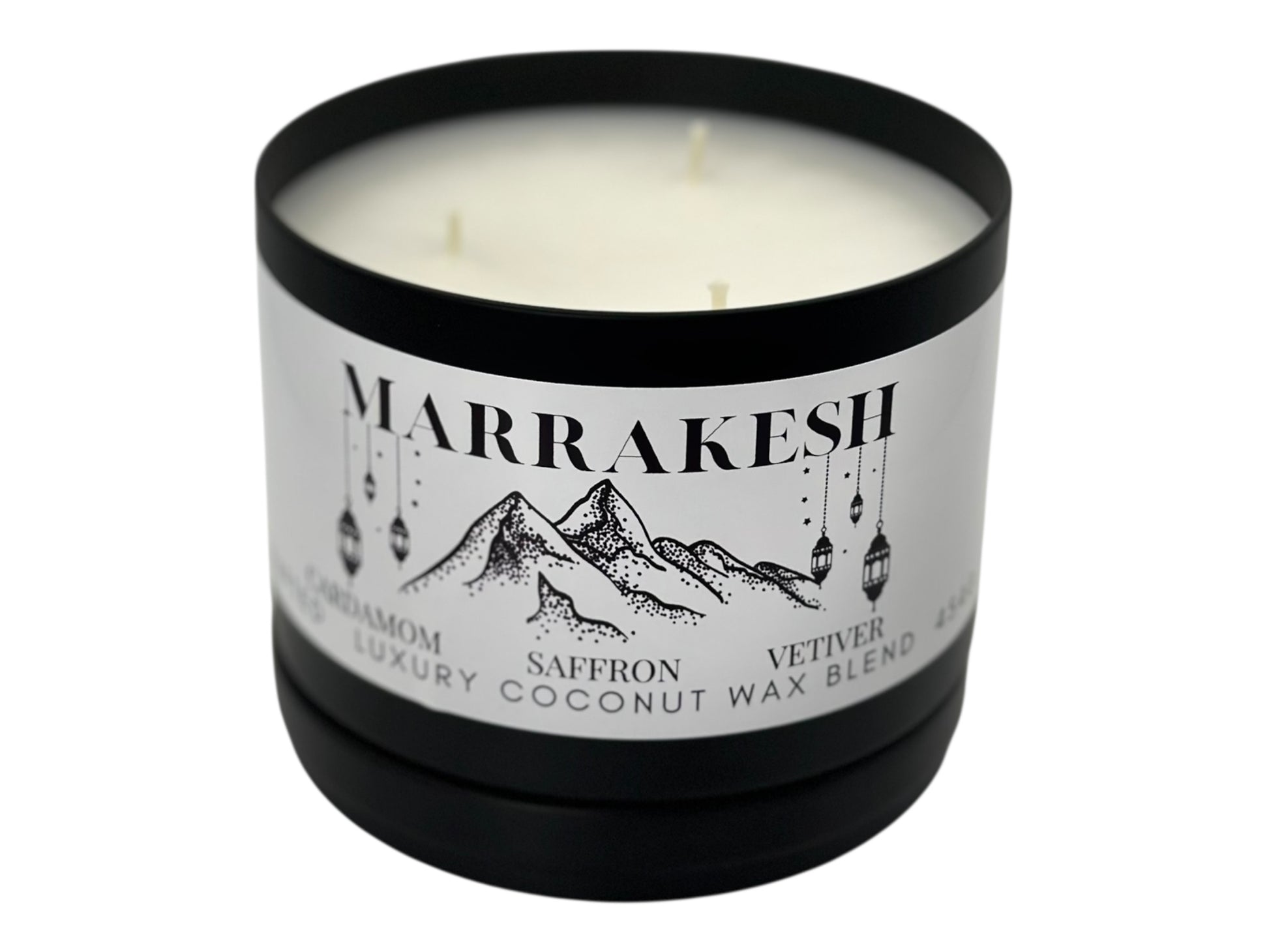 A black candle tin labeled "Marrakesh" lid removed with three wicks and a smooth white candle top on a white background.
