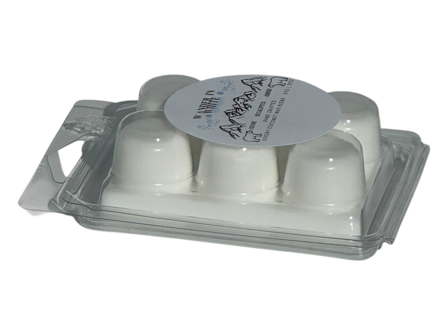 A winter wax melt labeled "Wander in White" in a clear clamshell with a glossy printed label on a white background front angled view.