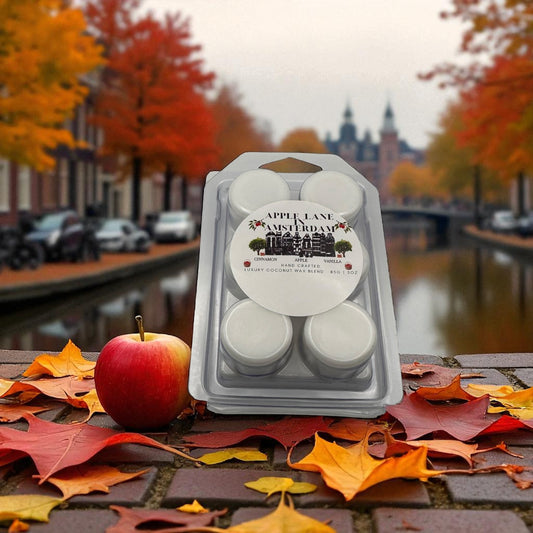 A package of wax melts labeled "Apple Lane in Amsterdam" with a scene of Amsterdam in Autumn in the background.