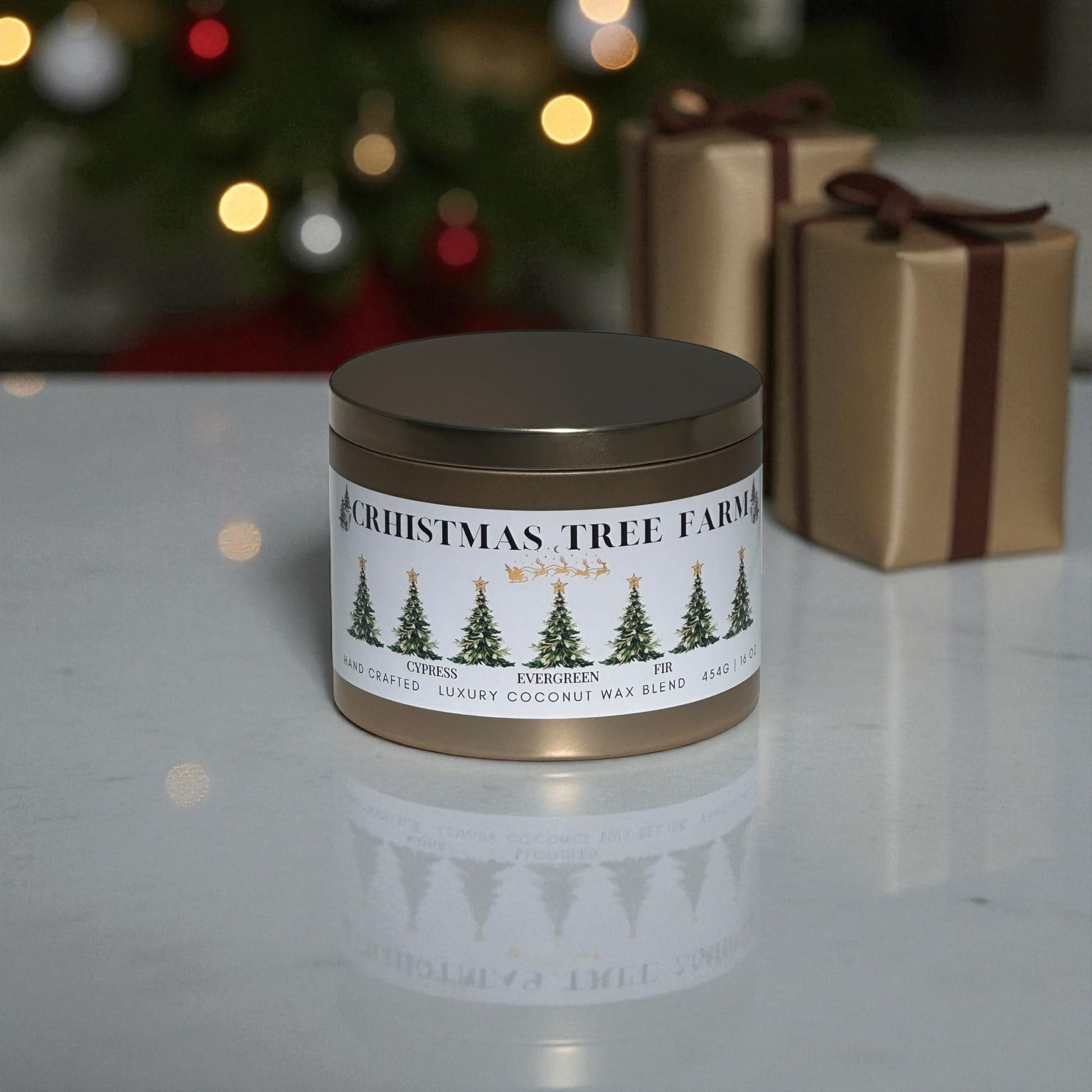 A gold candle tin labeled, "Christmas Tree Farm" sitting on a white marble counter top next to Christmas presents with a Christmas tree in the background.