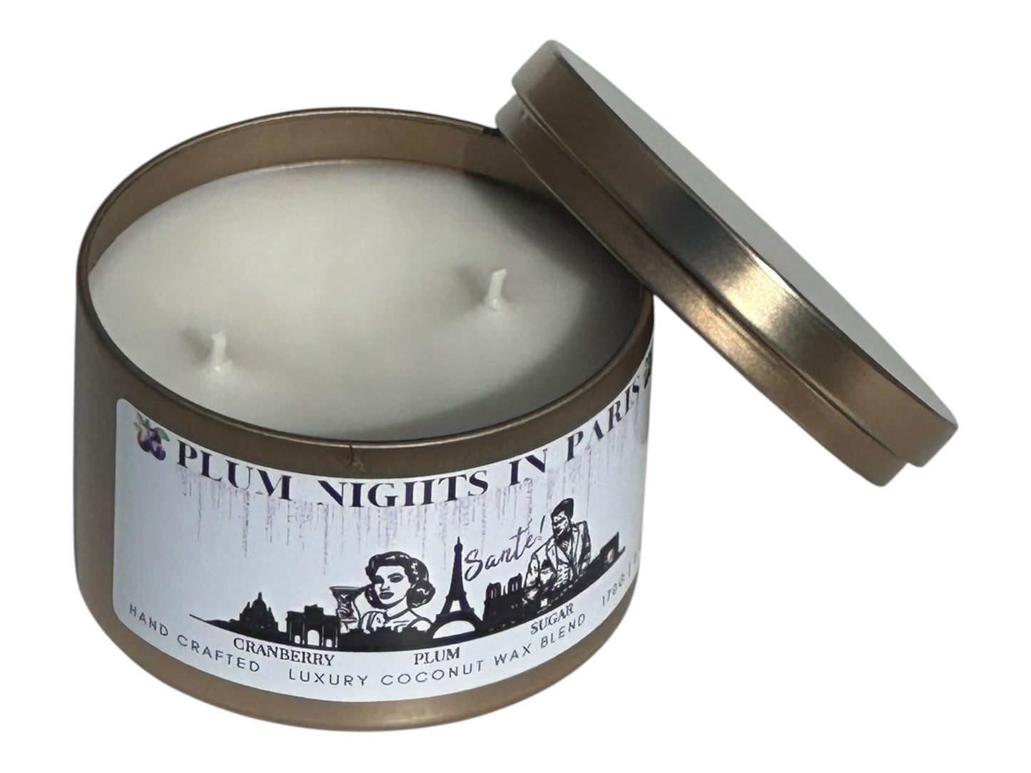A gold candle tin labeled, "Plum Nights in Paris" on a white background opposite side view with lid removed.