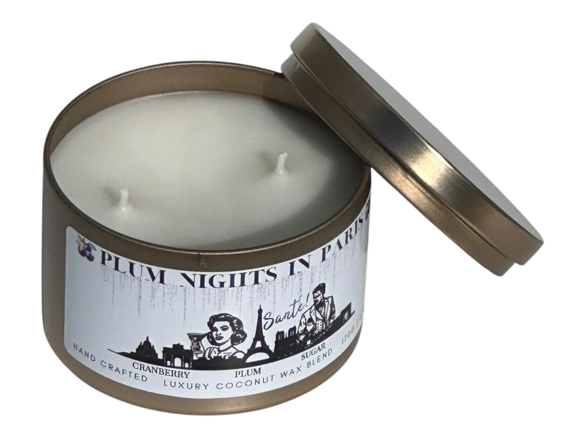 A gold candle tin labeled, "Plum Nights in Paris" on a white background opposite side view with lid removed.