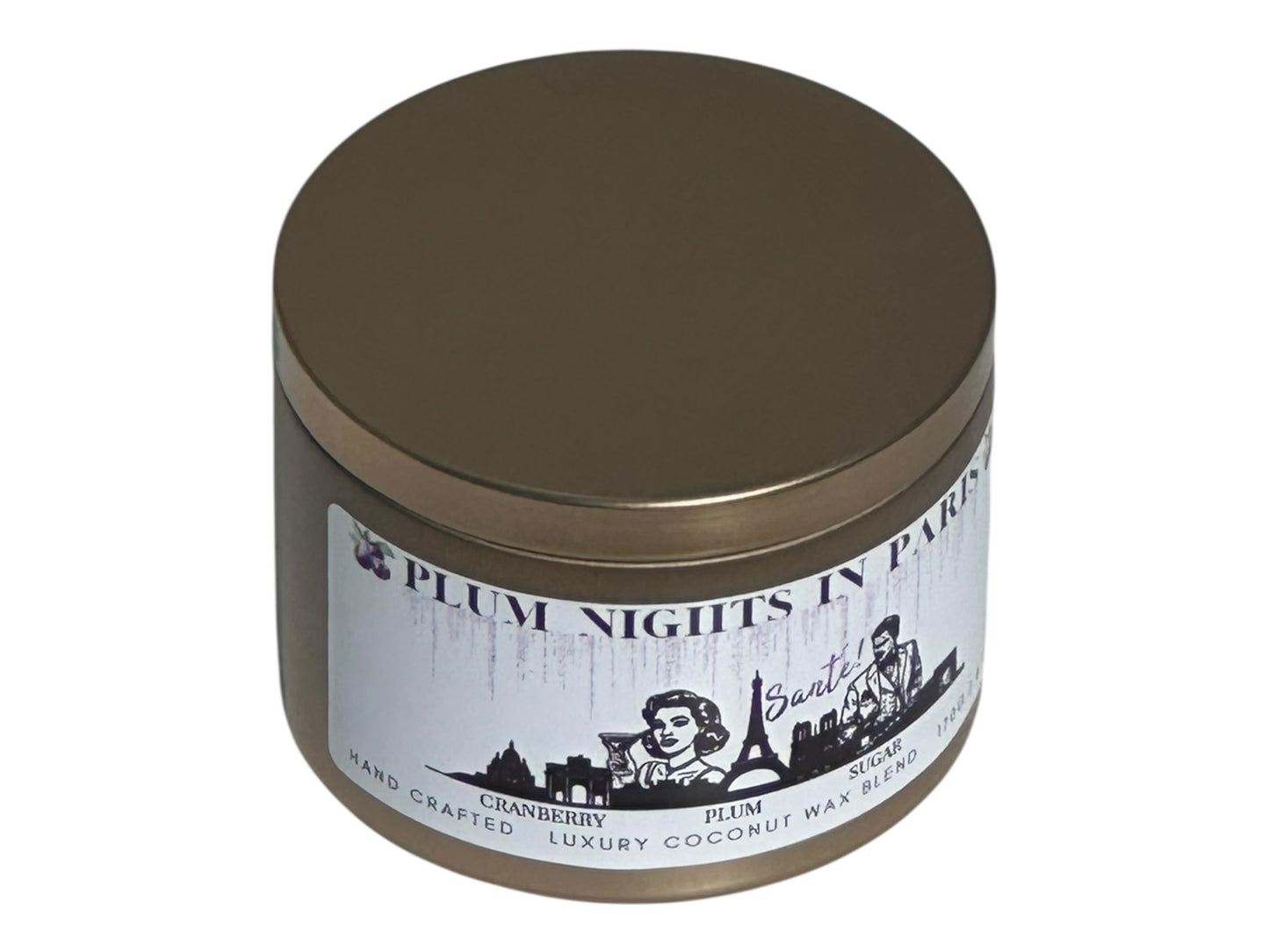 A gold candle tin labeled, "Plum Nights in Paris" on a white background side view.