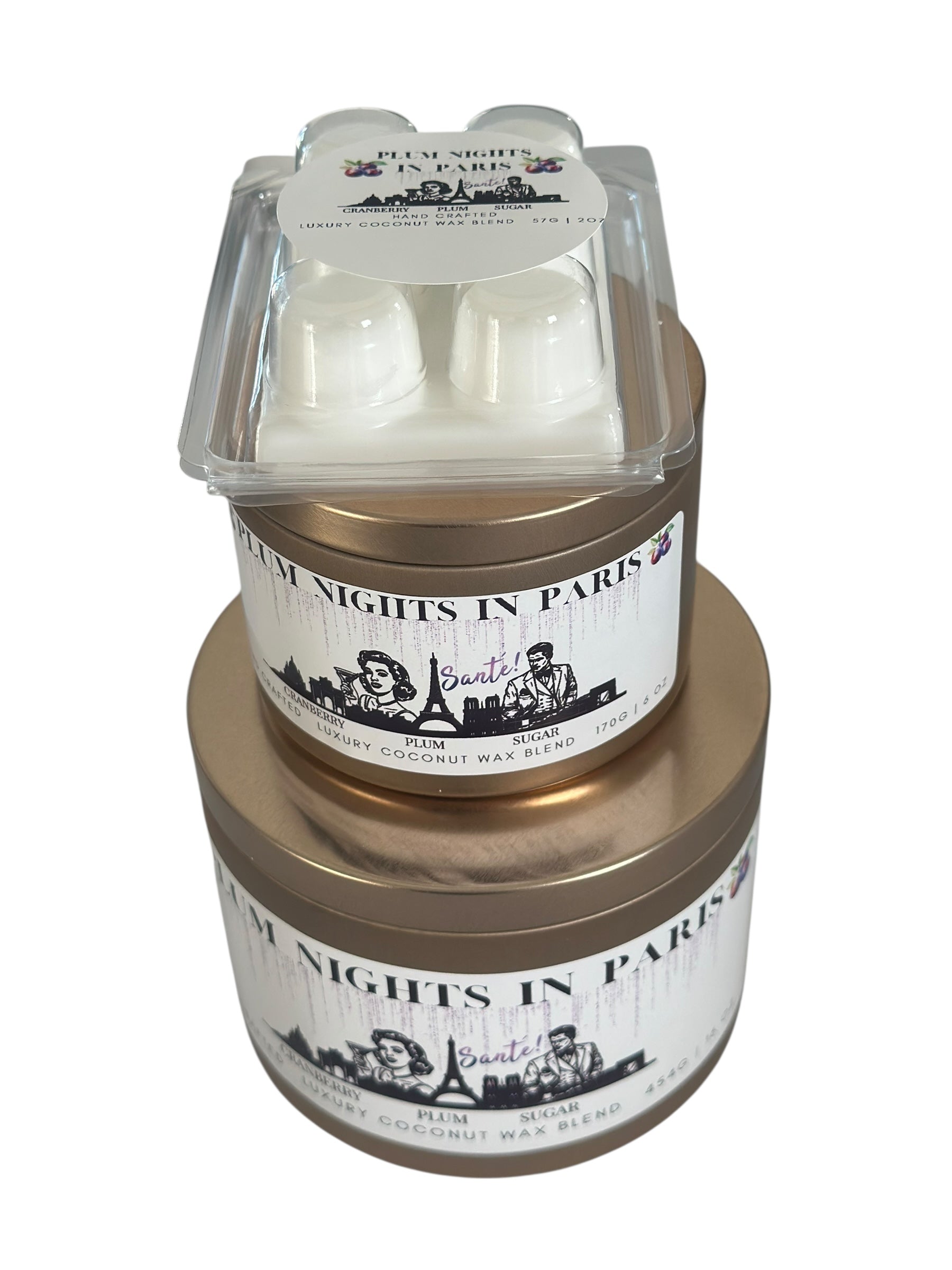 A Christmas collection of gold candle tins and white wax melts labeled "Plum Nights in Paris" on a white background.